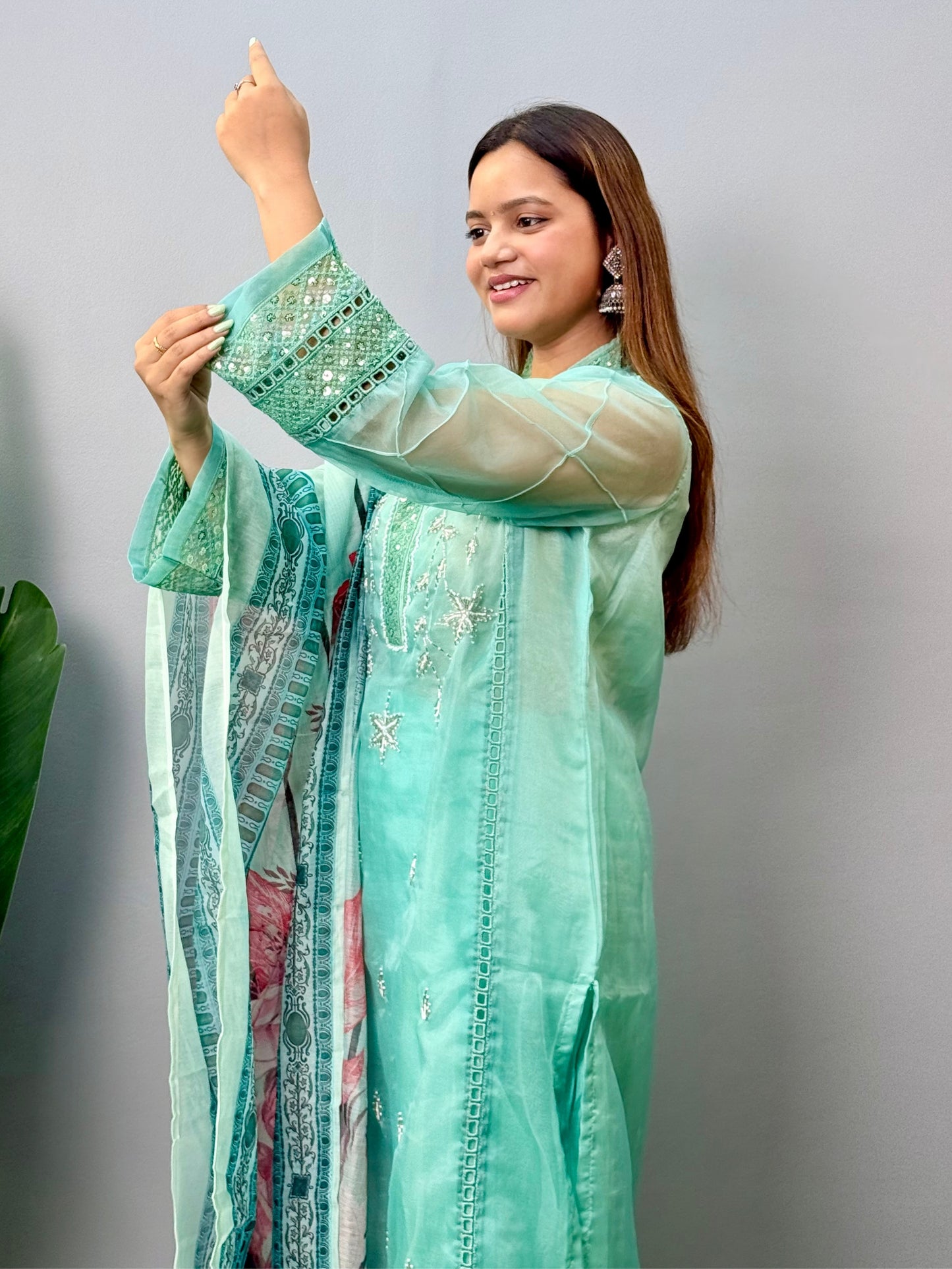Model wearing a mint green organza kurta with rayon pants and printed cotton dupatta – Designer Wear Collection.