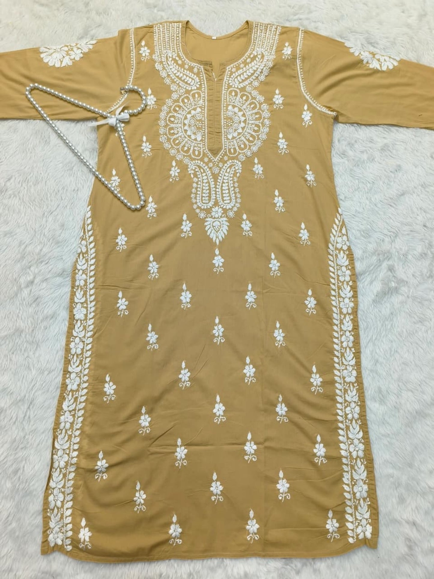 Camel brown cotton Lucknow Chikankari kurta with matching palazzo set, hand-embroidered in white thread.