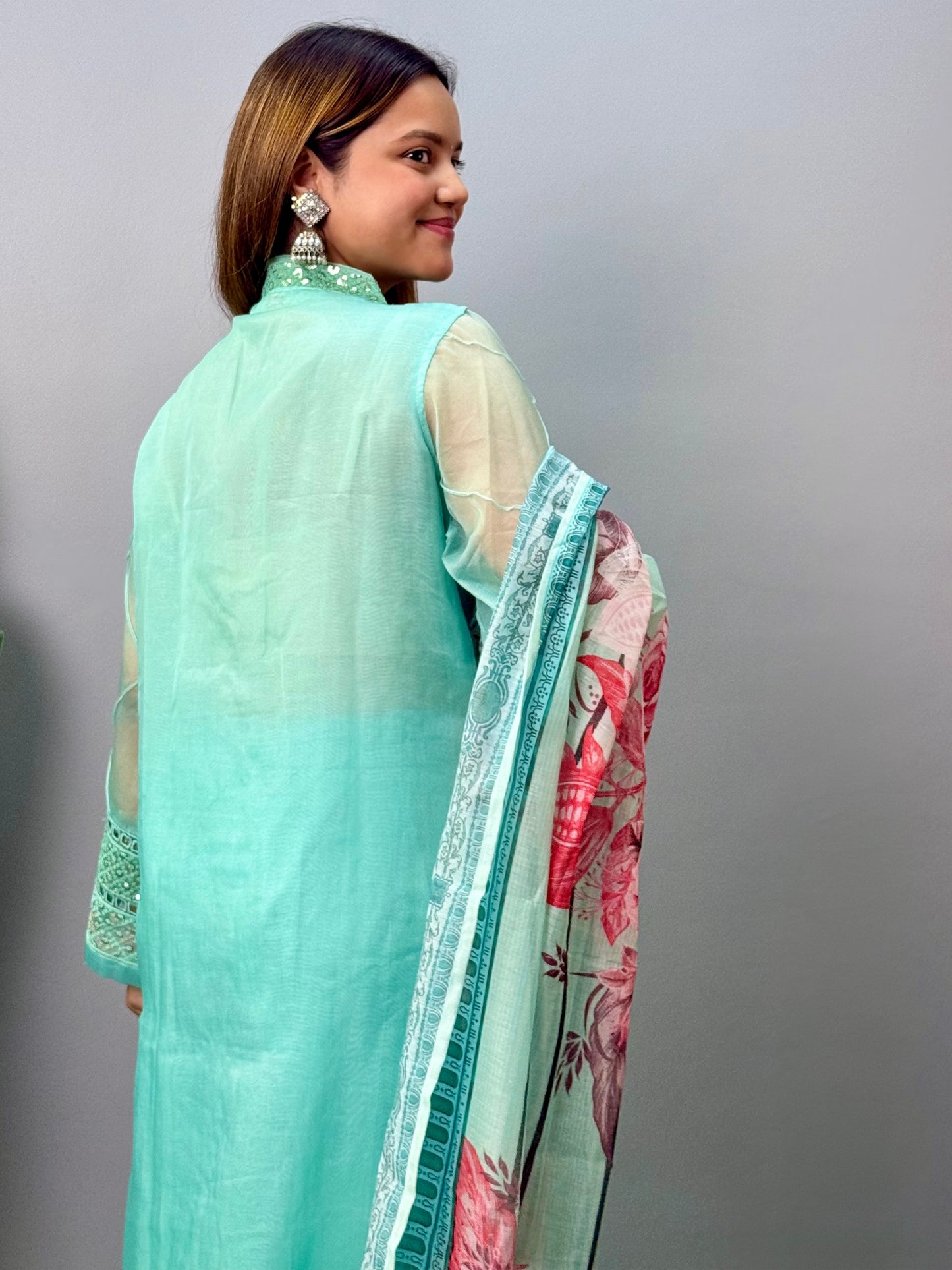 Model wearing a mint green organza kurta with rayon pants and printed cotton dupatta – Designer Wear Collection.