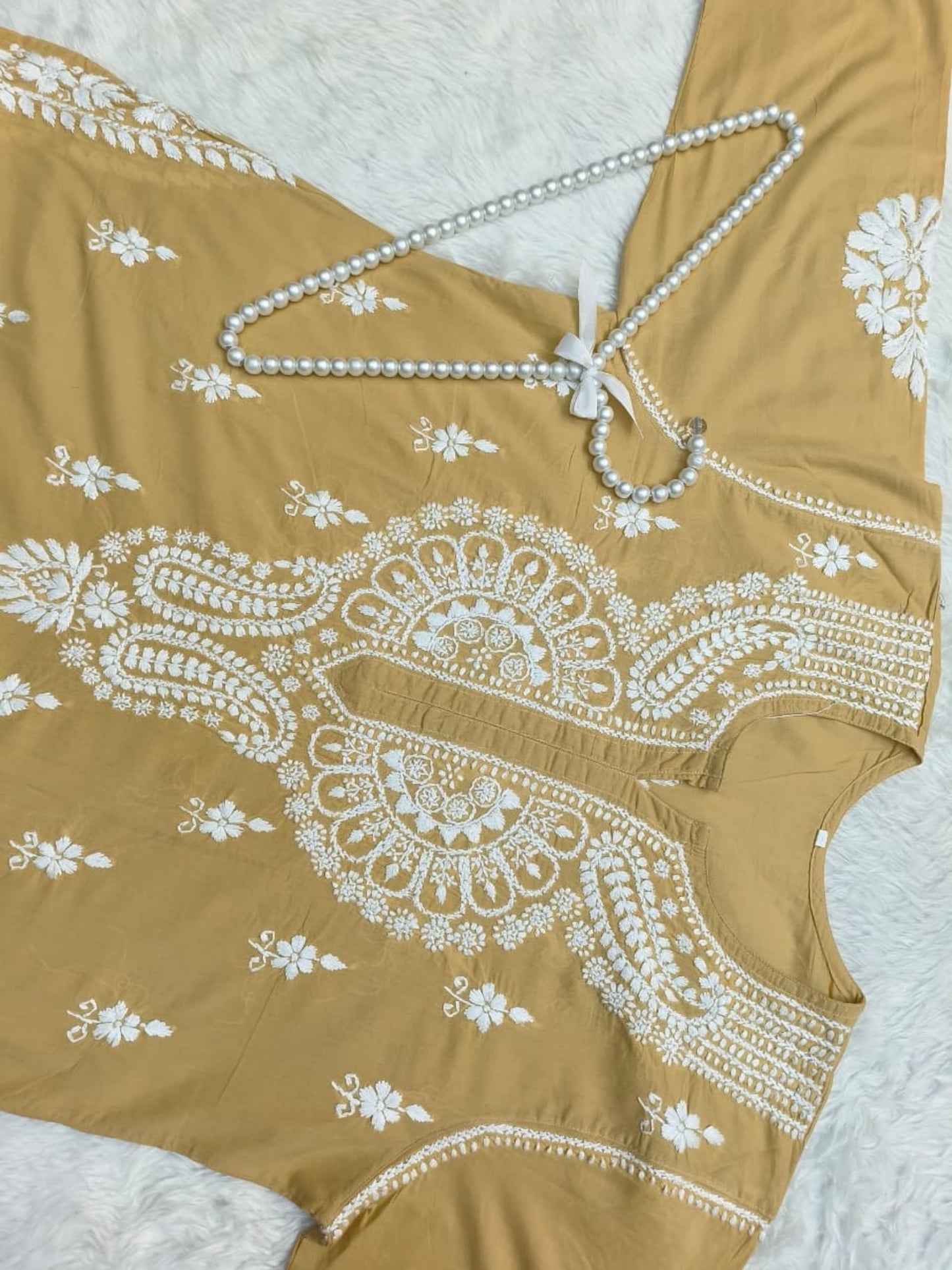 Camel brown cotton Lucknow Chikankari kurta with matching palazzo set, hand-embroidered in white thread.