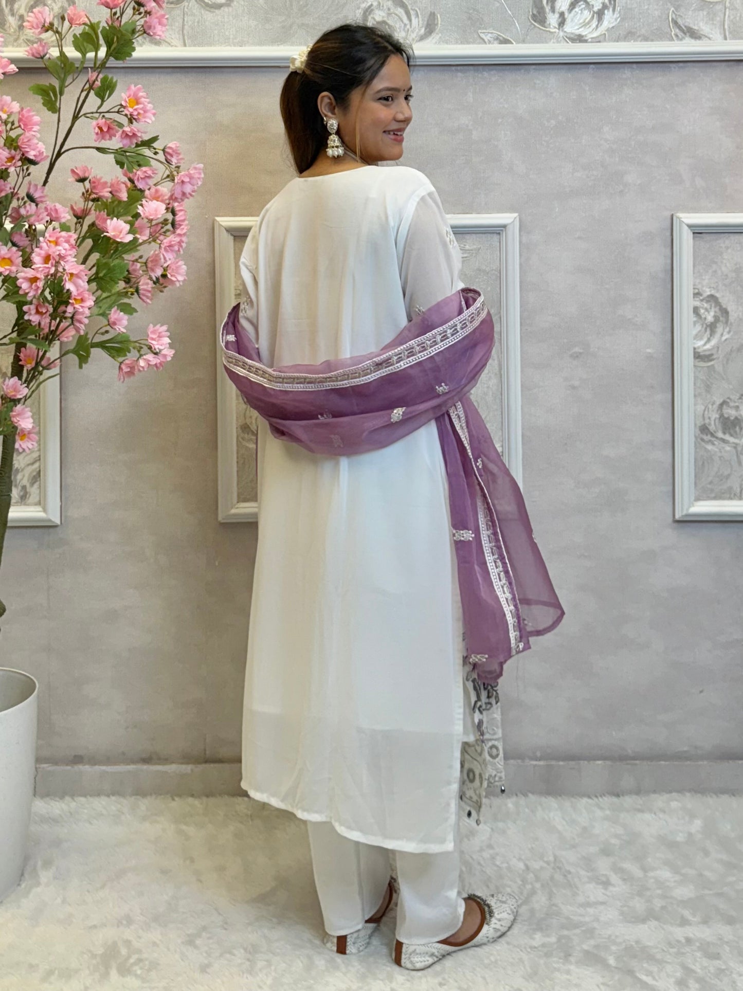 Model wearing a white embroidered georgette kurta with lycra stretchable pants and lavender embroidered georgette dupatta – Designer Wear Collection.