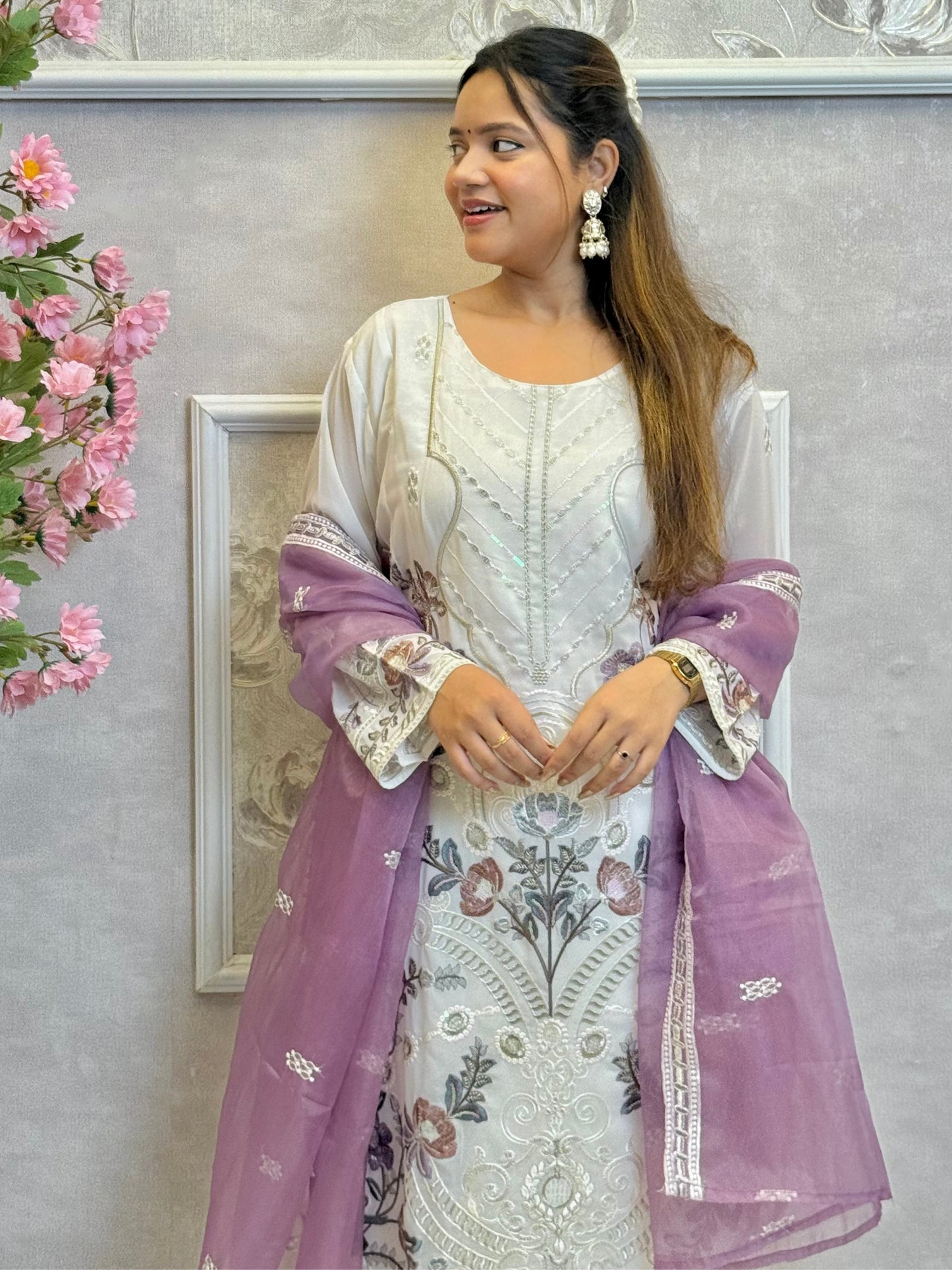 Model wearing a white embroidered georgette kurta with lycra stretchable pants and lavender embroidered georgette dupatta – Designer Wear Collection.