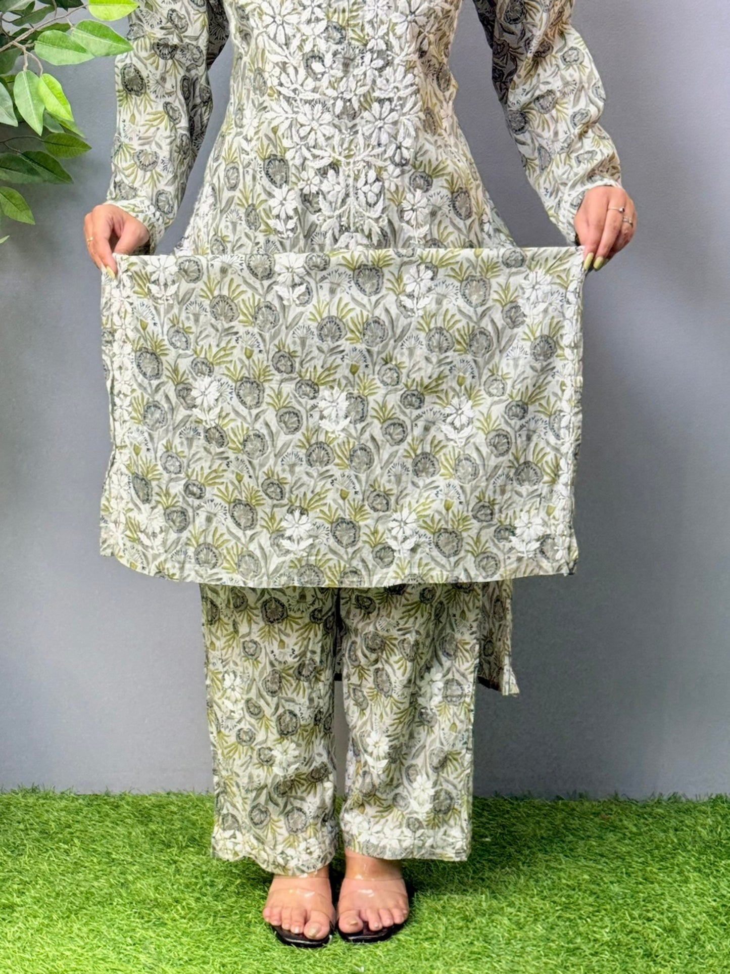 Model wearing olive grey printed mulmul chikankari kurta and pant set