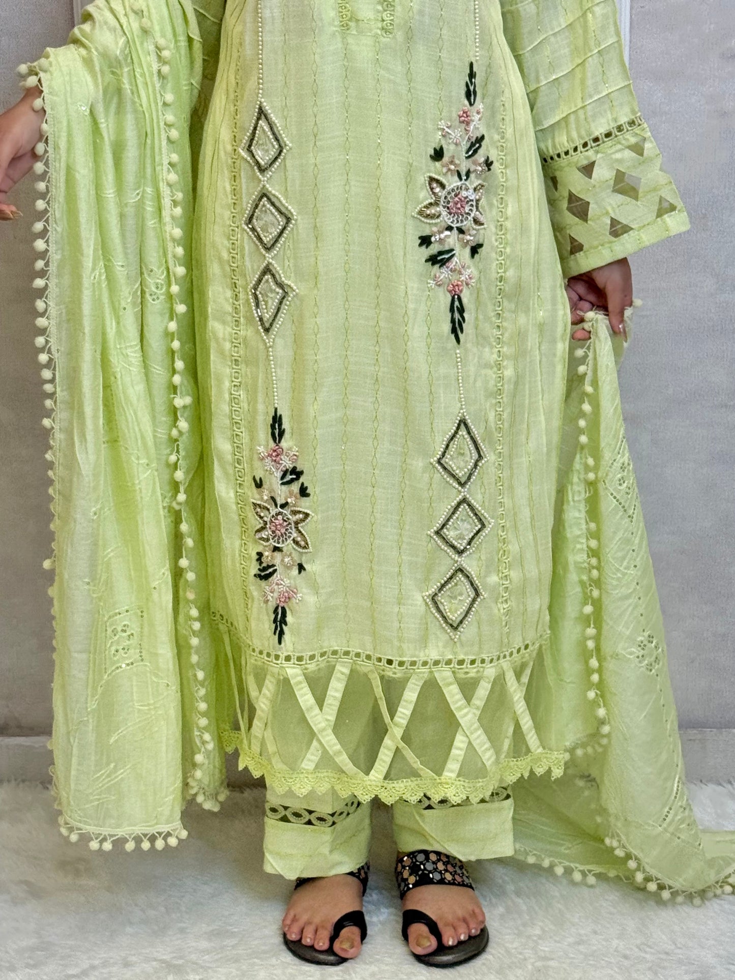 Model wearing a lime green rayon kurta with hand embroidery, paired with rayon pants and a chanderi dupatta – Designer Wear Collection.