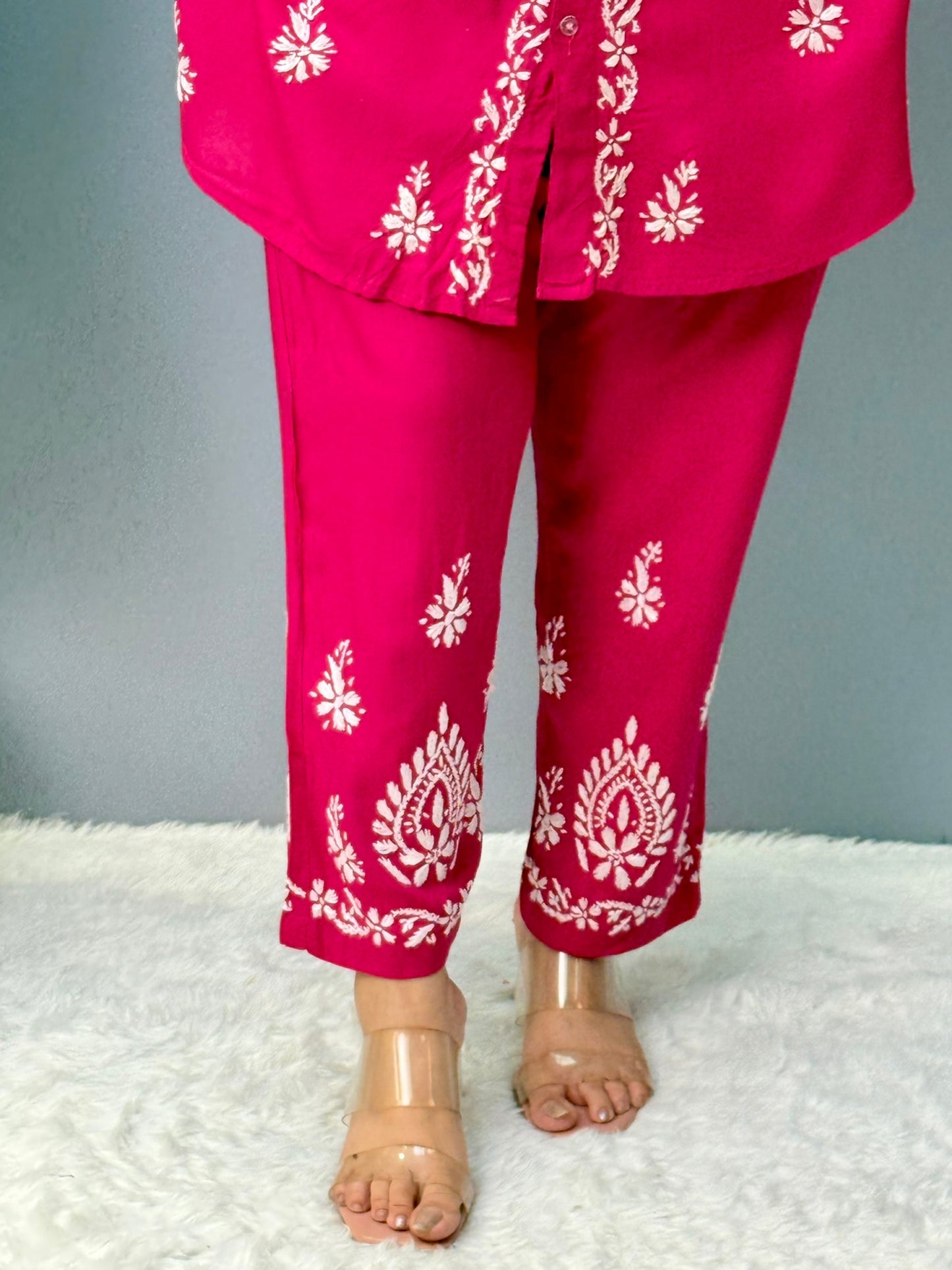 Woman wearing dark pink chikankari coord set with collared kurta and embroidered pants