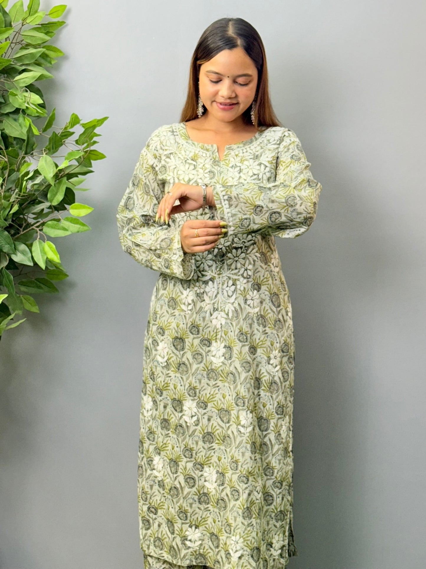 Model wearing olive grey printed mulmul chikankari kurta and pant set