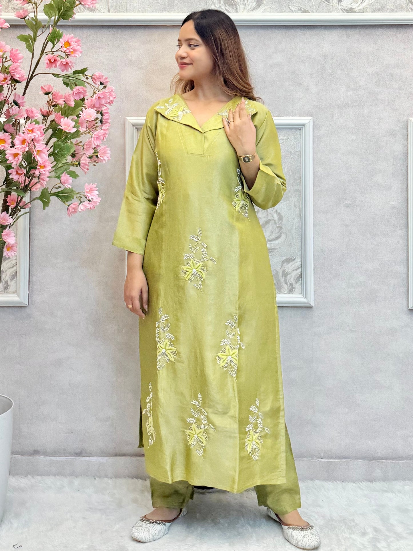 Model wearing an olive green tissue silk kurta with hand embroidery, paired with tissue silk pants and an organza dupatta – Designer Wear Collection.