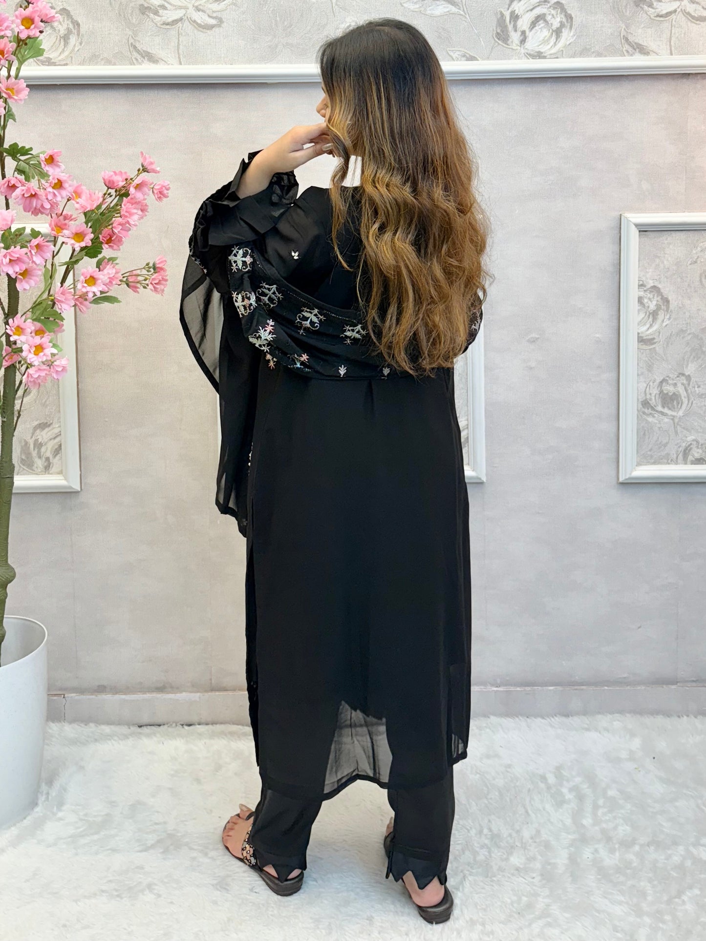 Model wearing a black embroidered georgette kurta with lycra stretchable pants and georgette embroidered dupatta – Designer Wear Collection.