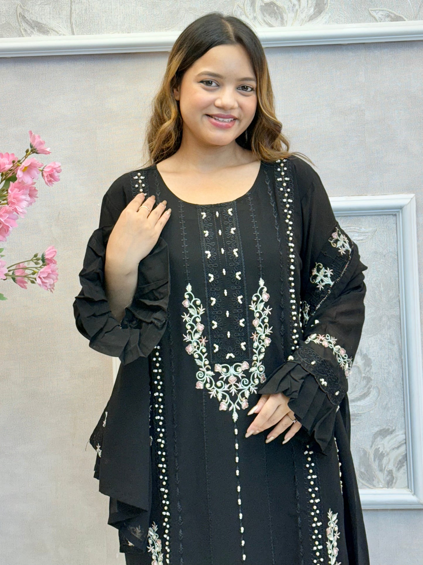 Model wearing a black embroidered georgette kurta with lycra stretchable pants and georgette embroidered dupatta – Designer Wear Collection.