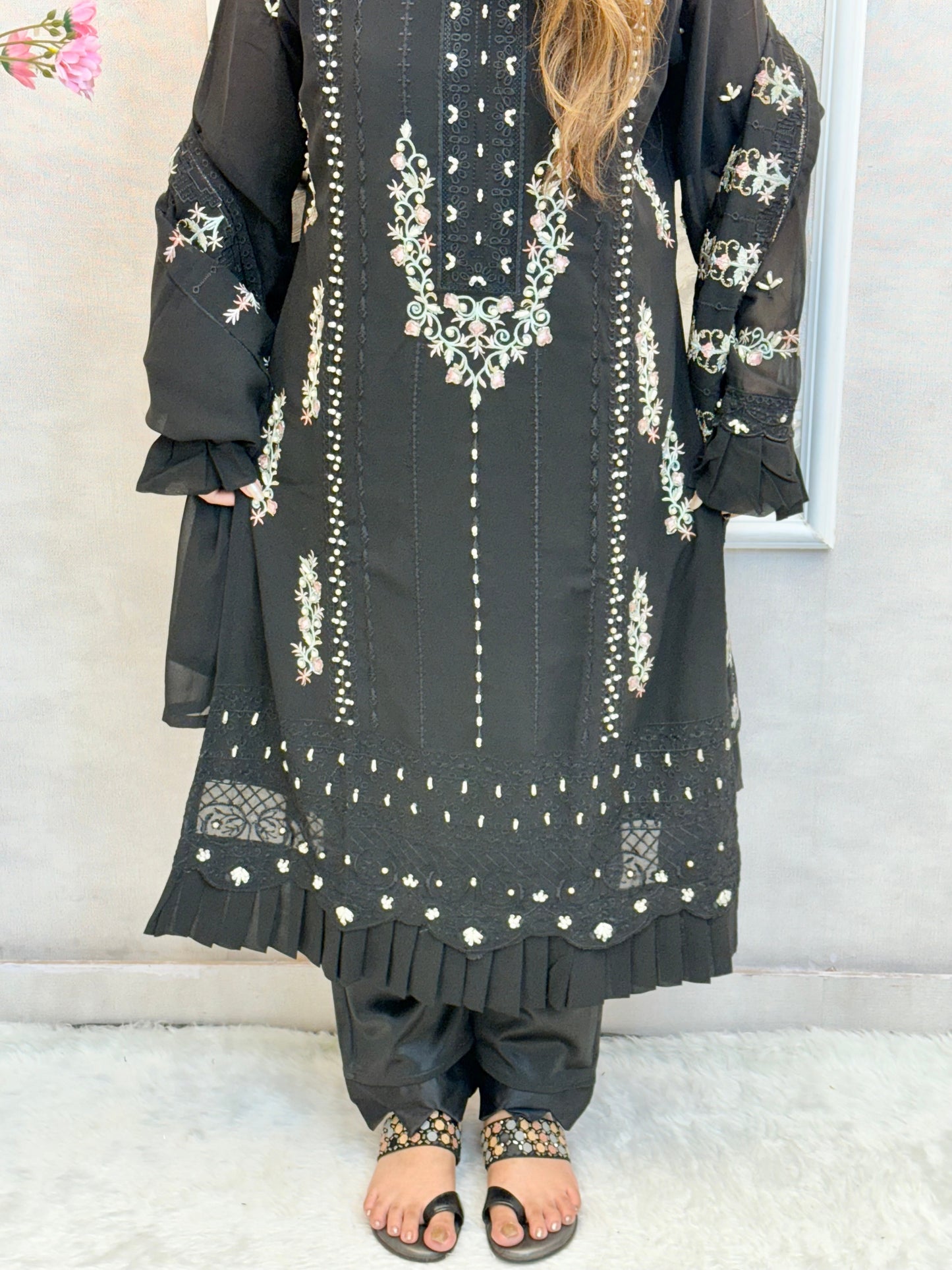 Model wearing a black embroidered georgette kurta with lycra stretchable pants and georgette embroidered dupatta – Designer Wear Collection.