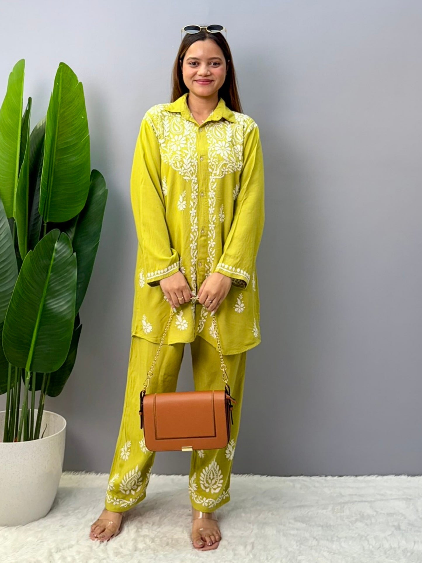 Woman wearing mustard lime chikankari coord set with embroidered kurta and pant