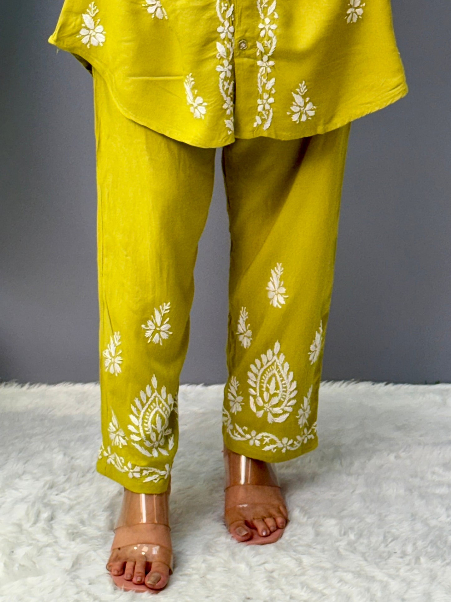 Woman wearing mustard lime chikankari coord set with embroidered kurta and pant