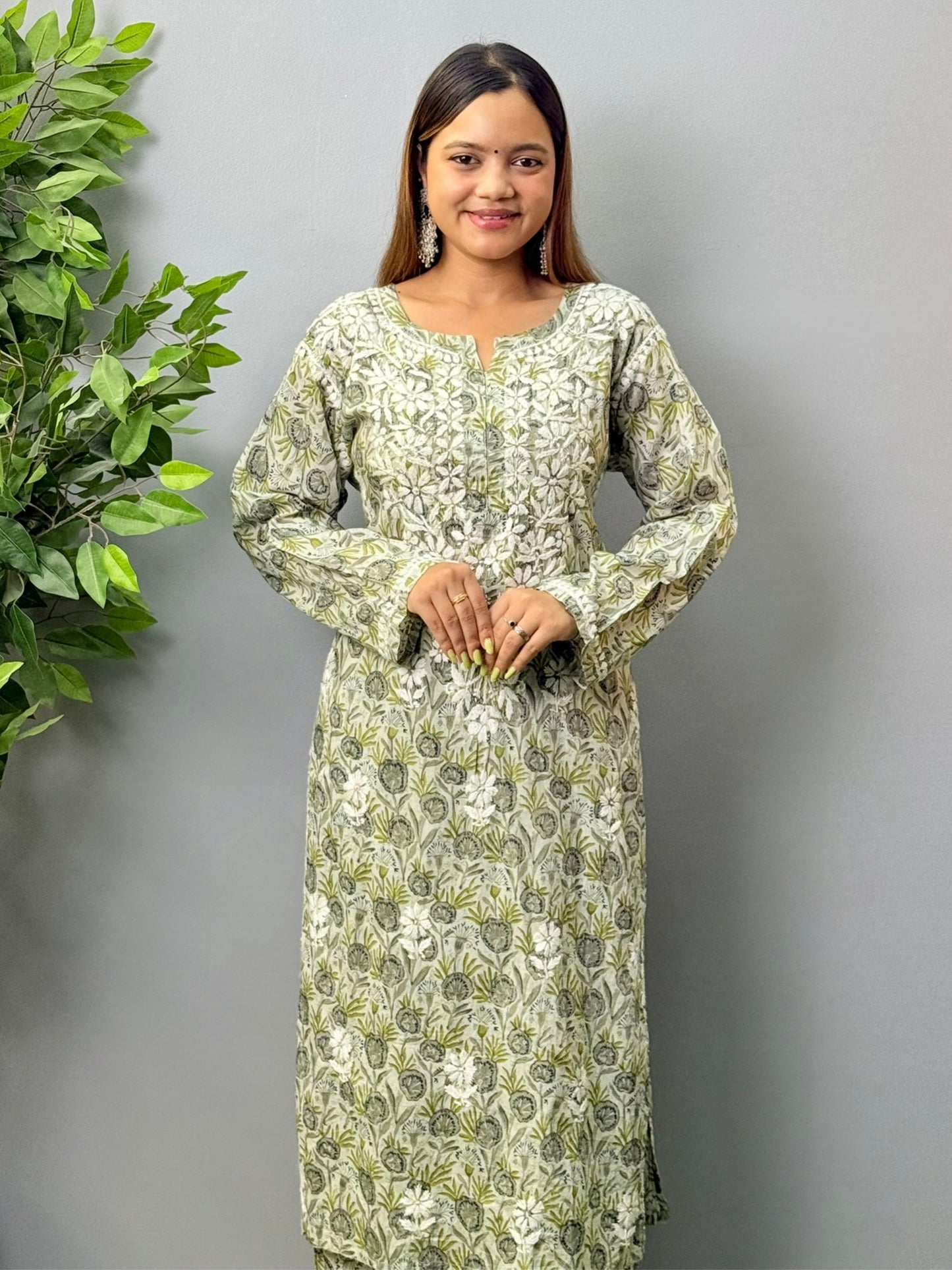 Model wearing olive grey printed mulmul chikankari kurta and pant set