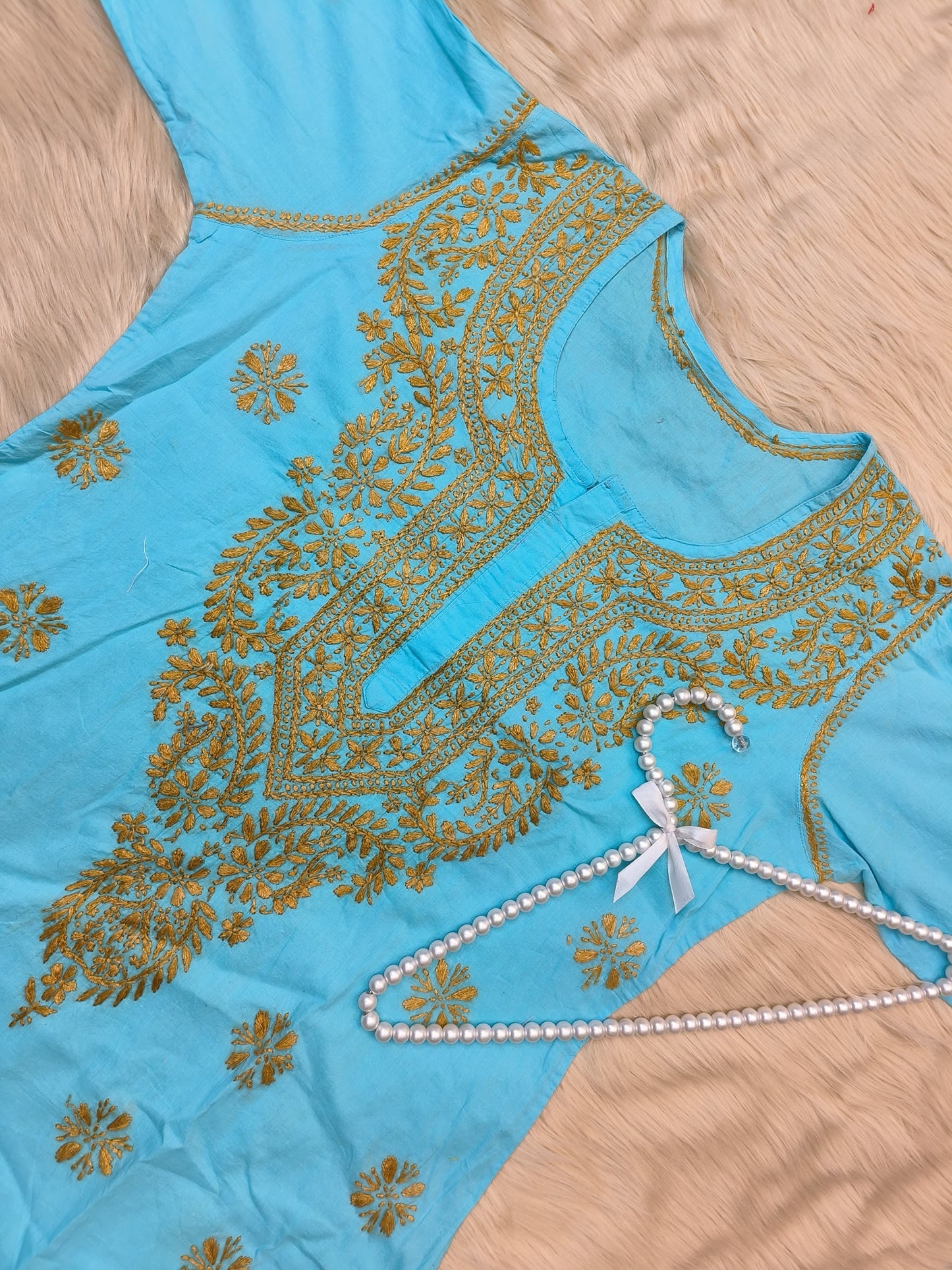 Sky blue cotton chikankari kurta with mustard hand embroidery, ideal for casual wear