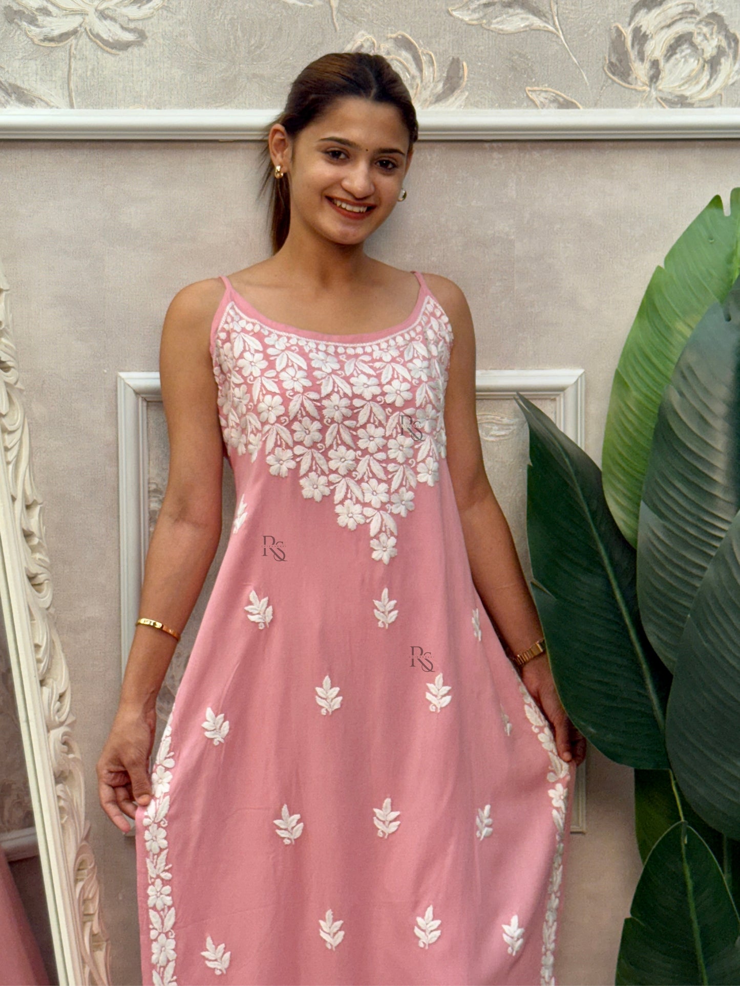 Pink sleeveless Lucknow Chikankari kurta and pant set with hand embroidery in rayon fabric