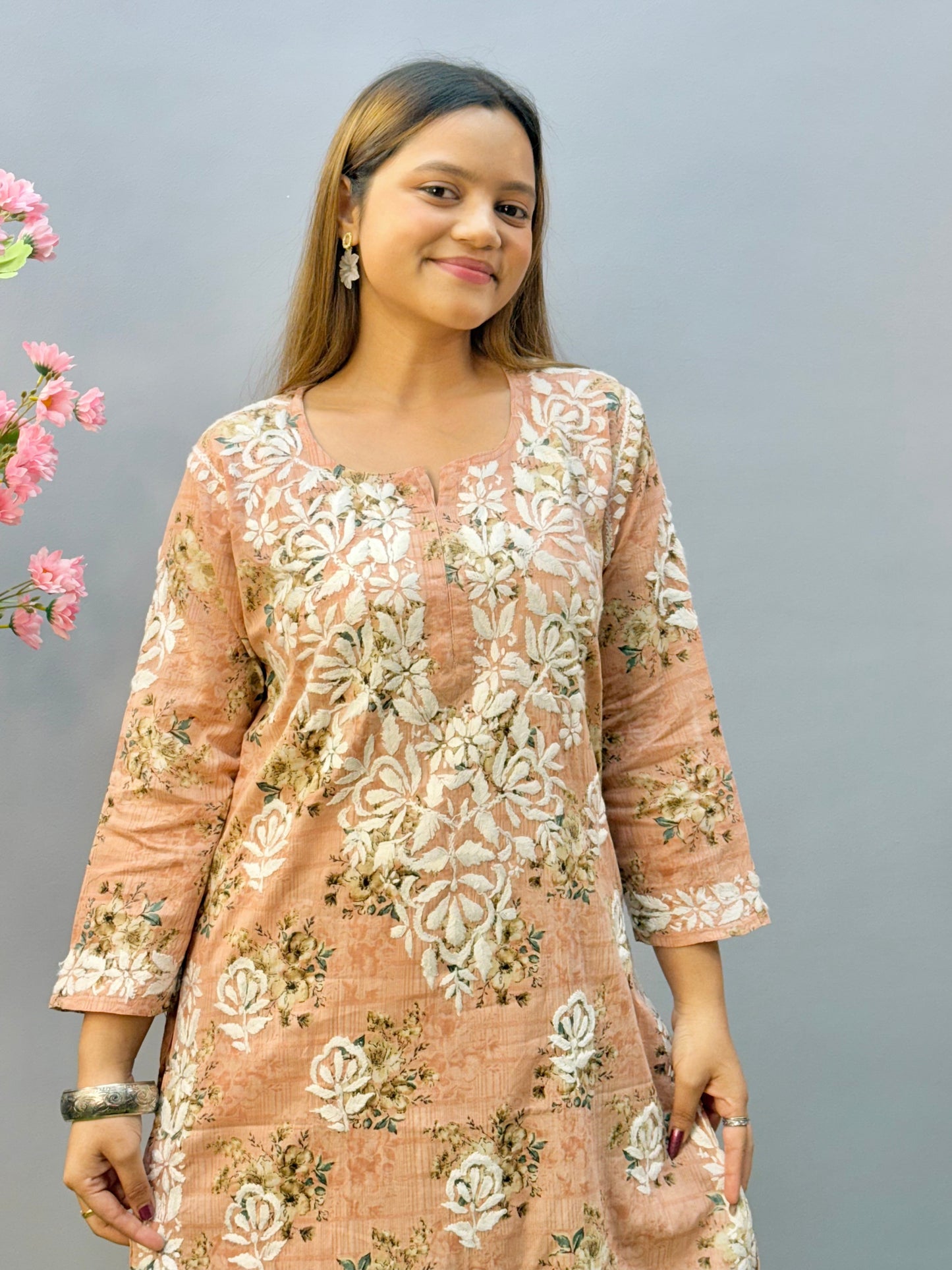Warm peach printed Lucknow Chikankari mulmul kurta palazzo set with lace detailing