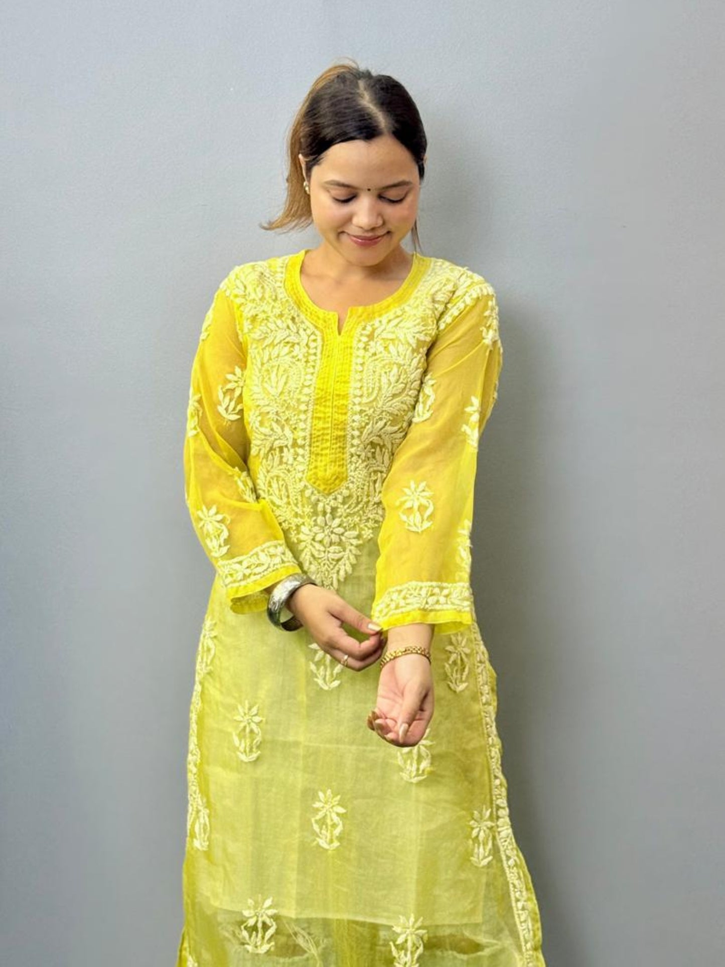 Lemon yellow sheer organza chikankari kurta with hand embroidery in white thread