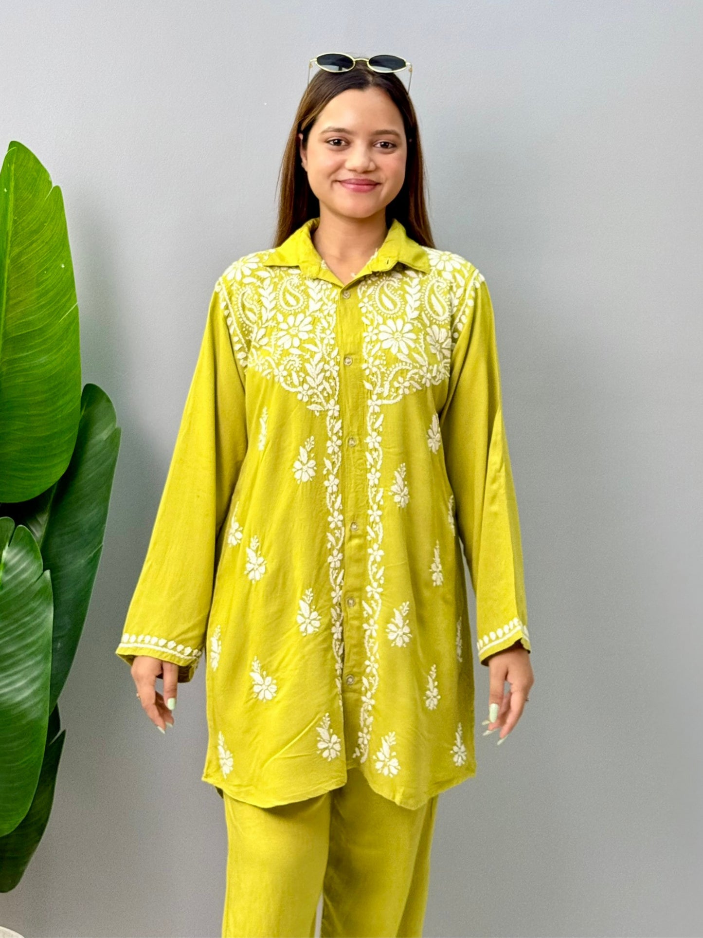 Woman wearing mustard lime chikankari coord set with embroidered kurta and pant