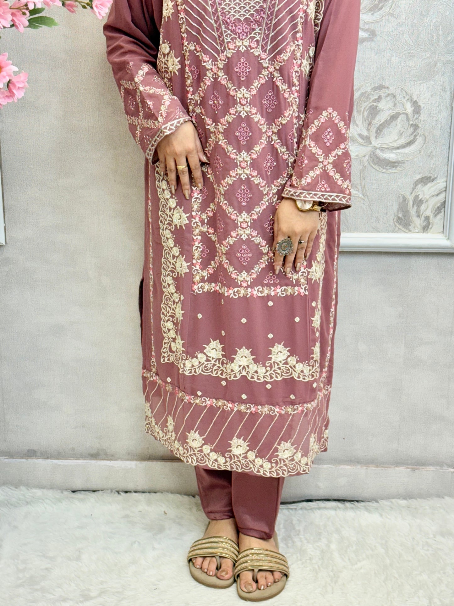 Model wearing a mauve georgette embroidered kurta with lycra stretchable pants and embroidered georgette dupatta – Designer Wear Collection.