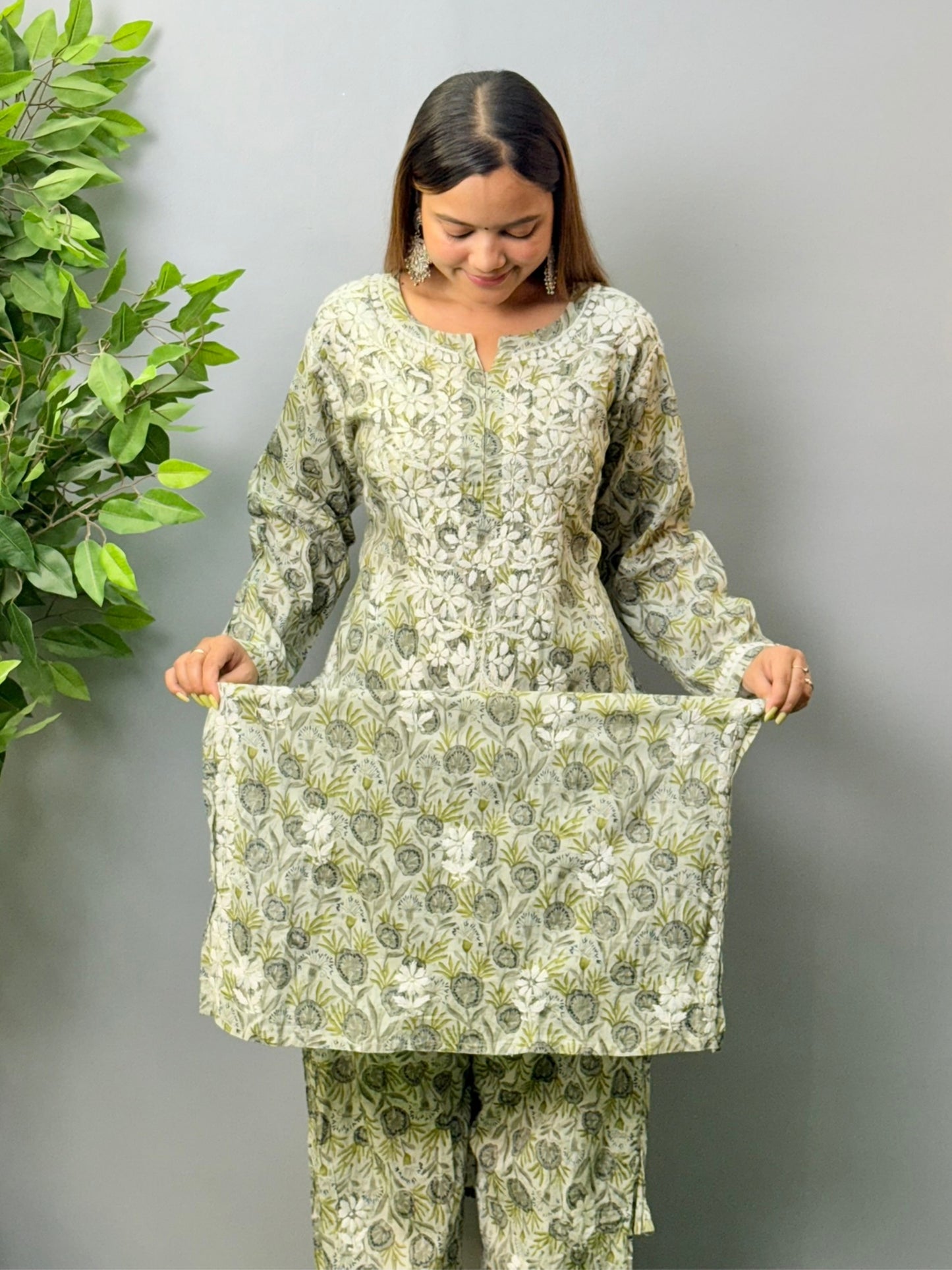 Model wearing olive grey printed mulmul chikankari kurta and pant set