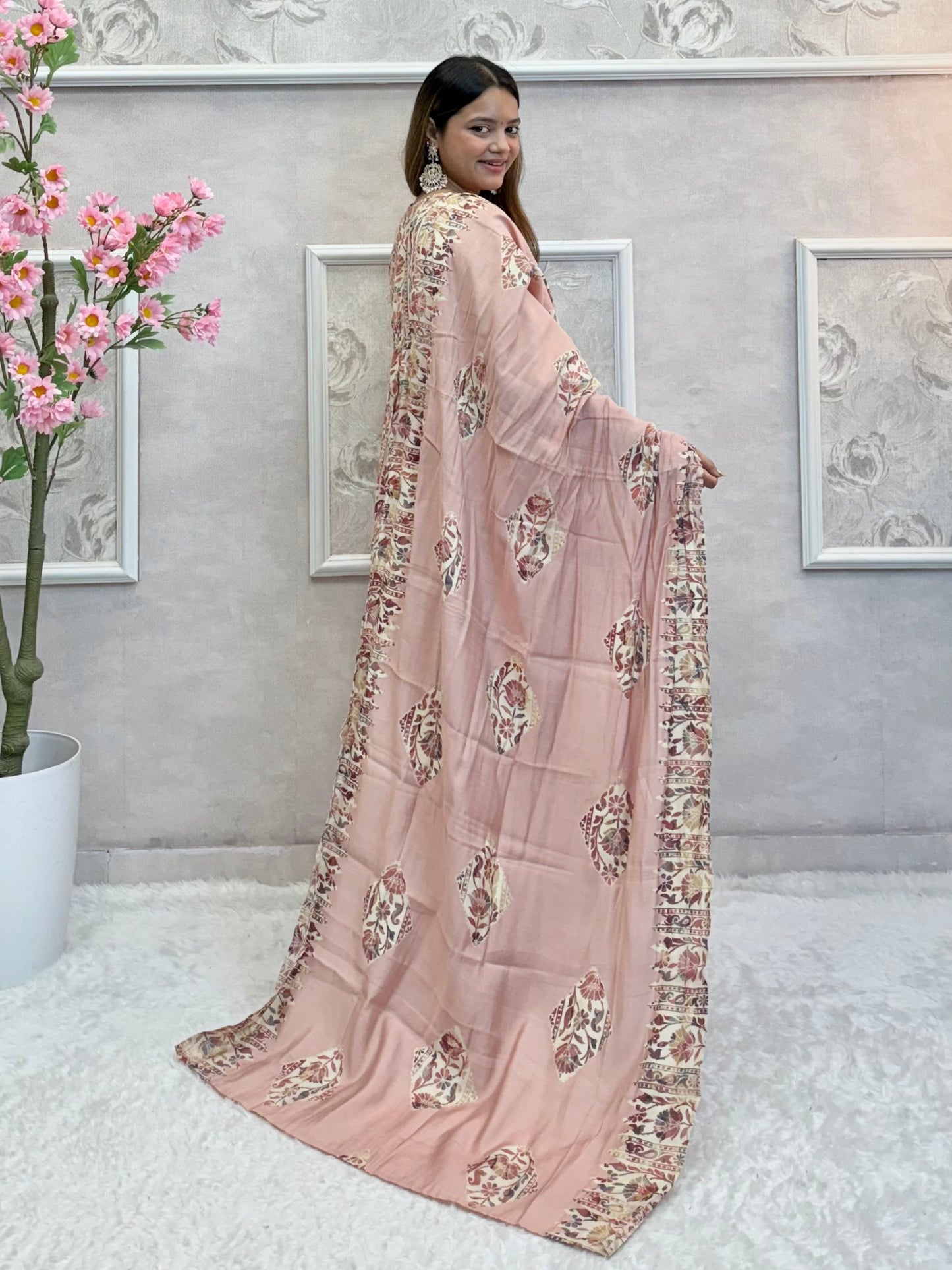 Model wearing a dusty rose floral long flared chanderi silk dress with hand embroidery – Designer Wear Collection.