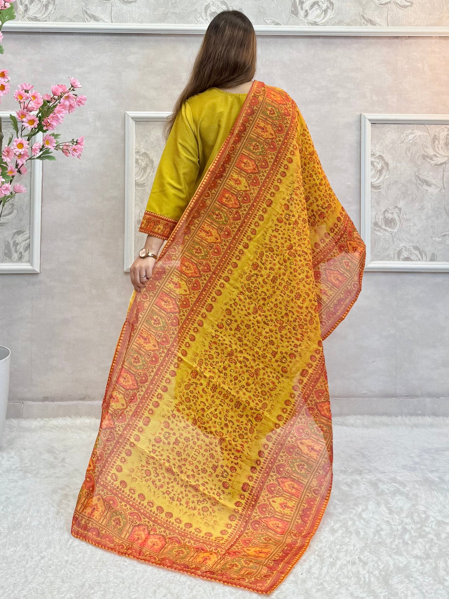 Model wearing a mustard yellow chanderi kurta with hand embroidery, paired with chanderi pants and a red-golden woven chanderi dupatta – Designer Wear Collection.