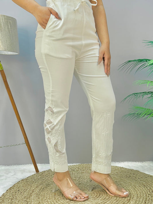 White dyable Lucknow Chikankari straight pant in cotton lycra fabric with delicate hand embroidery – stretchable and versatile.