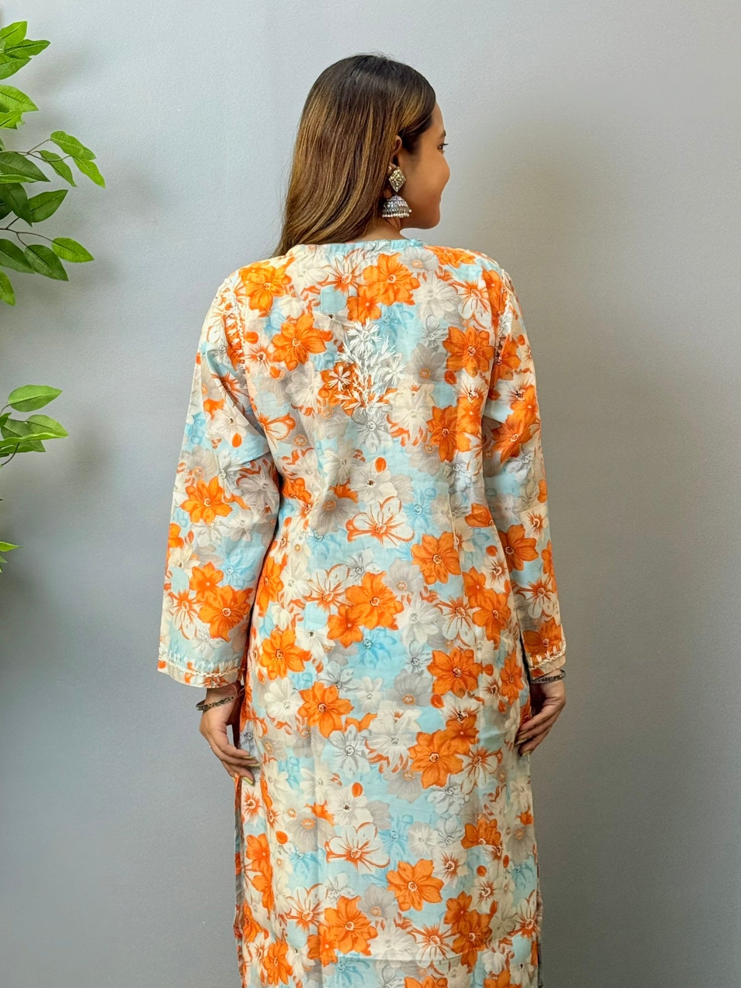 Model wearing sky blue and orange printed chikankari crape kurta with white embroidery
