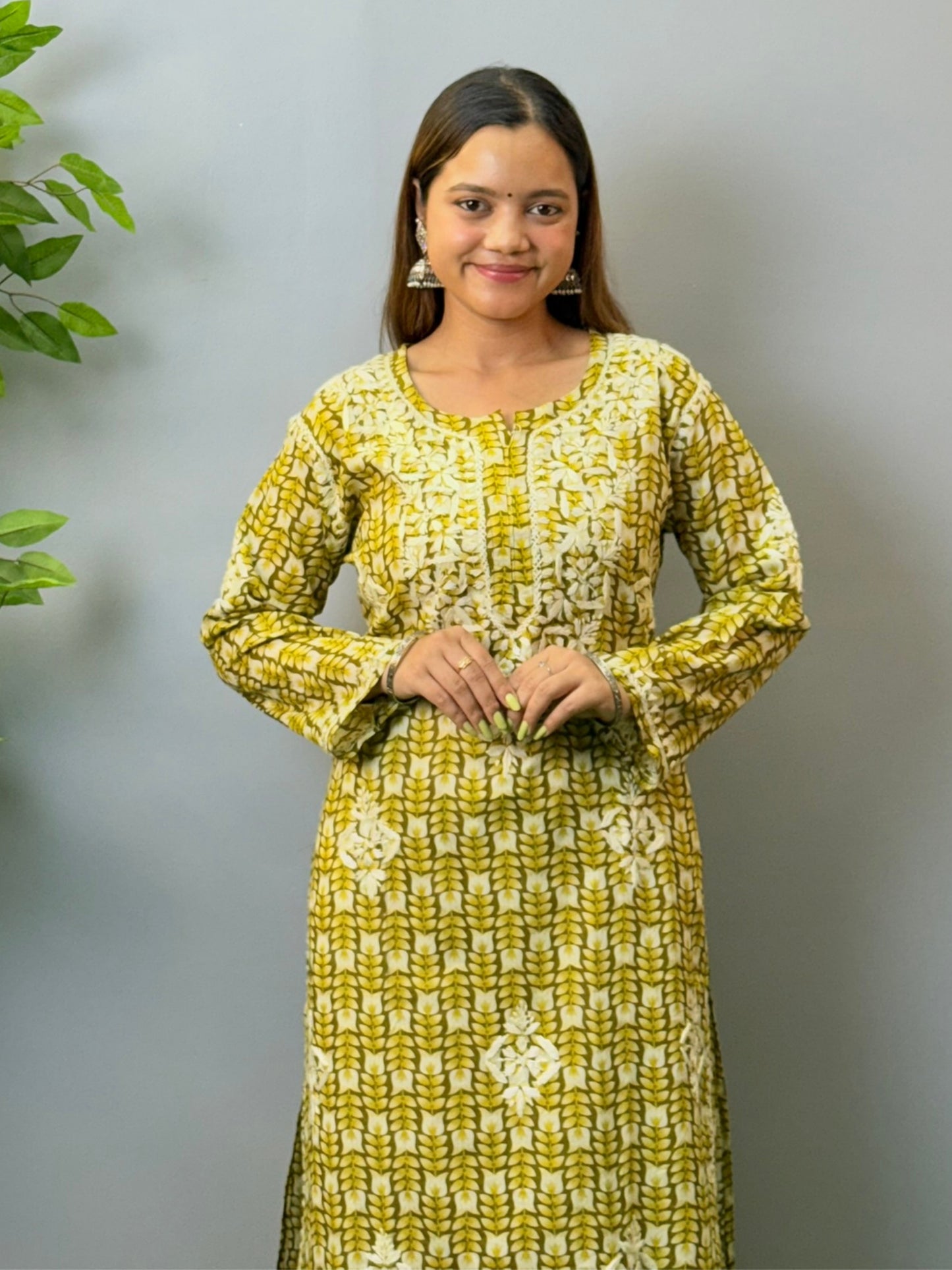 Model in olive green printed mulmul chikankari kurta with hand embroidery