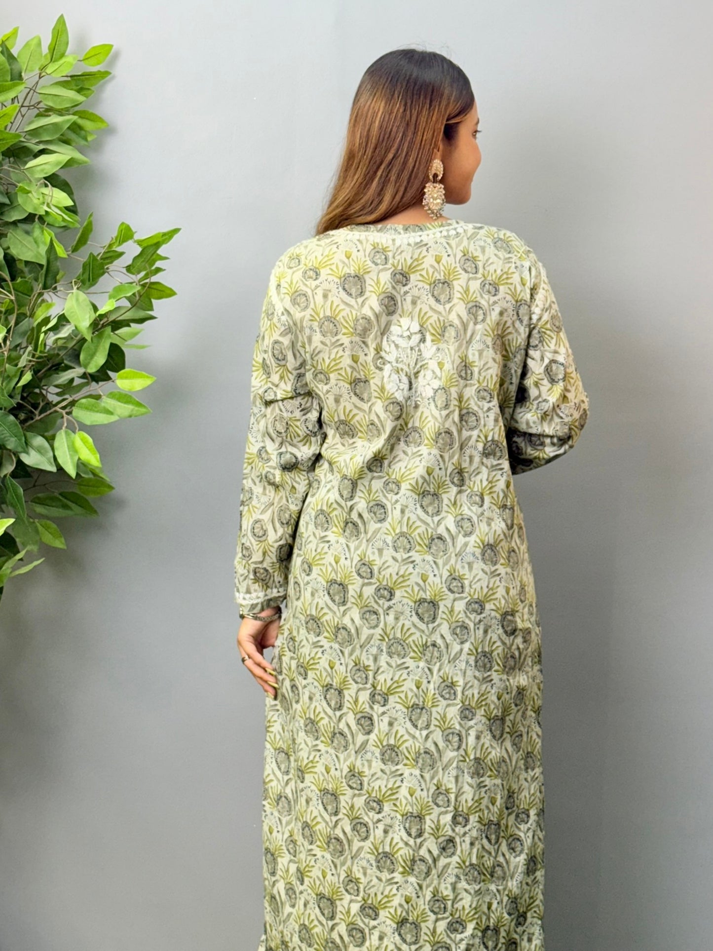 Model wearing olive grey printed mulmul chikankari kurta and pant set