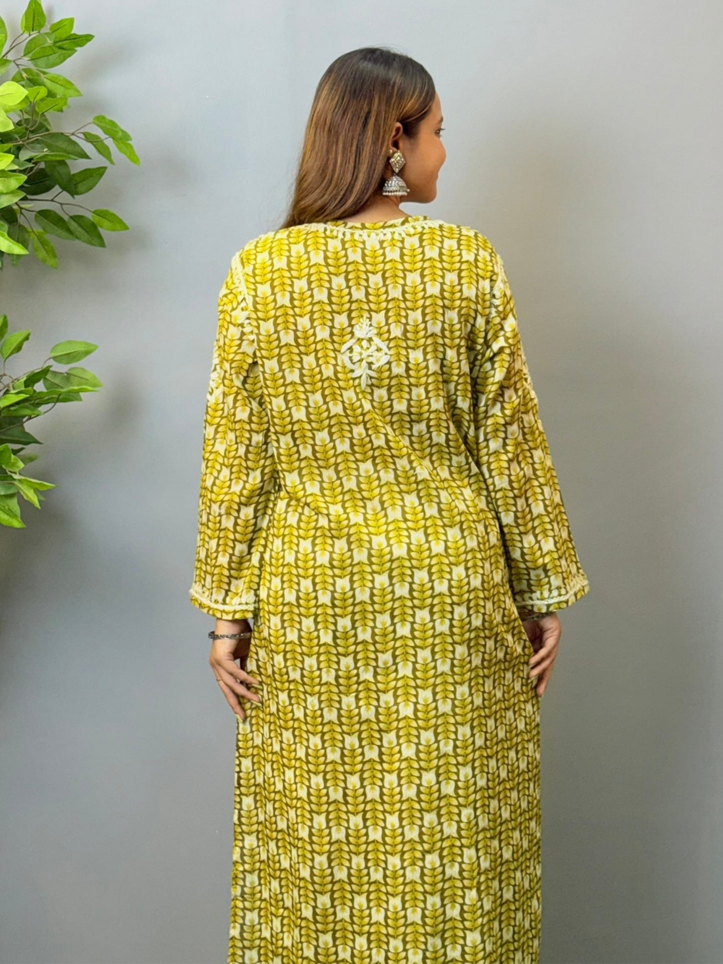 Model in olive green printed mulmul chikankari kurta with hand embroidery