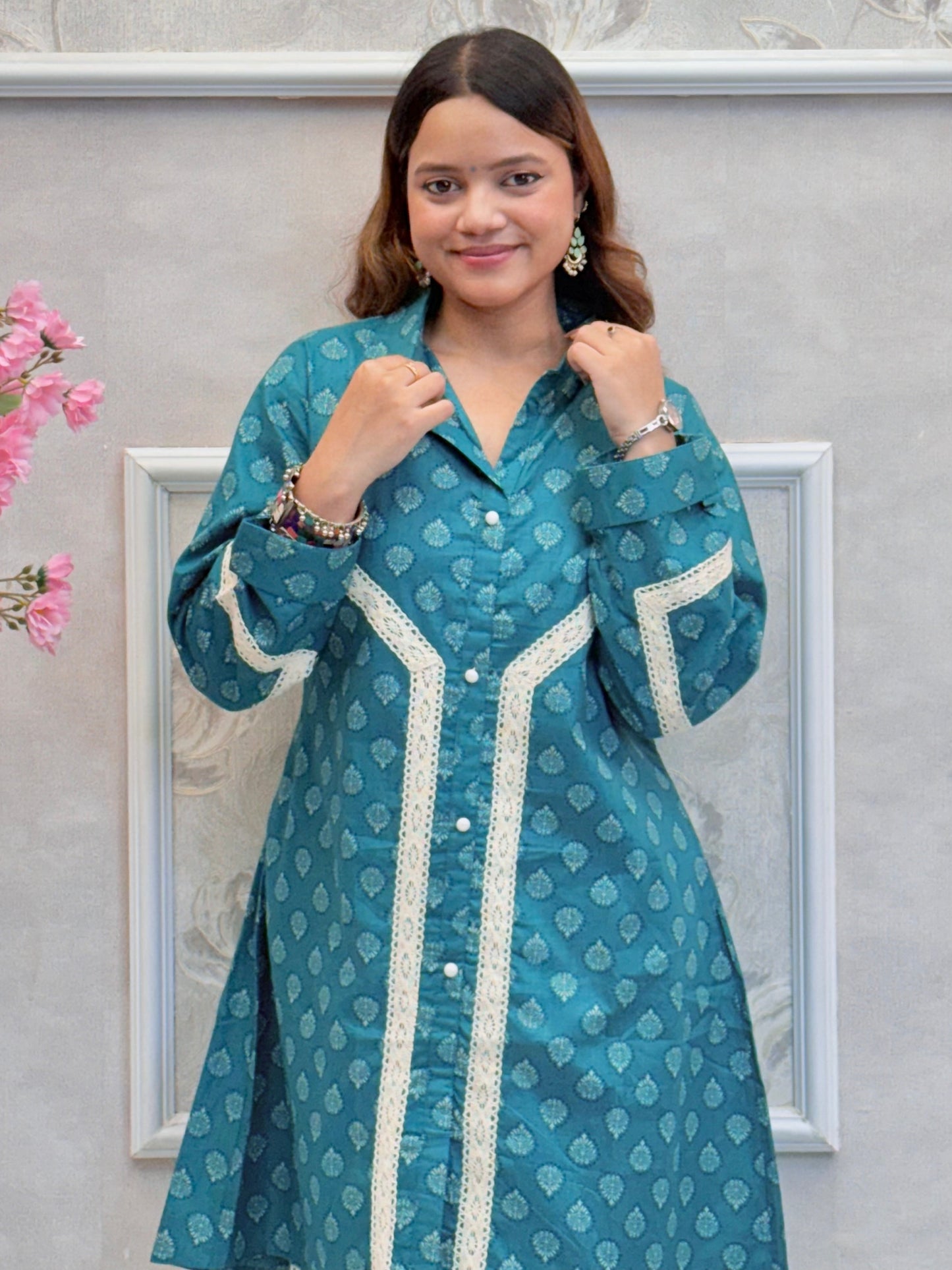 Model wearing a teal blue mulmul co-ord set with button-down kurta and printed straight pants – Designer Wear Collection.