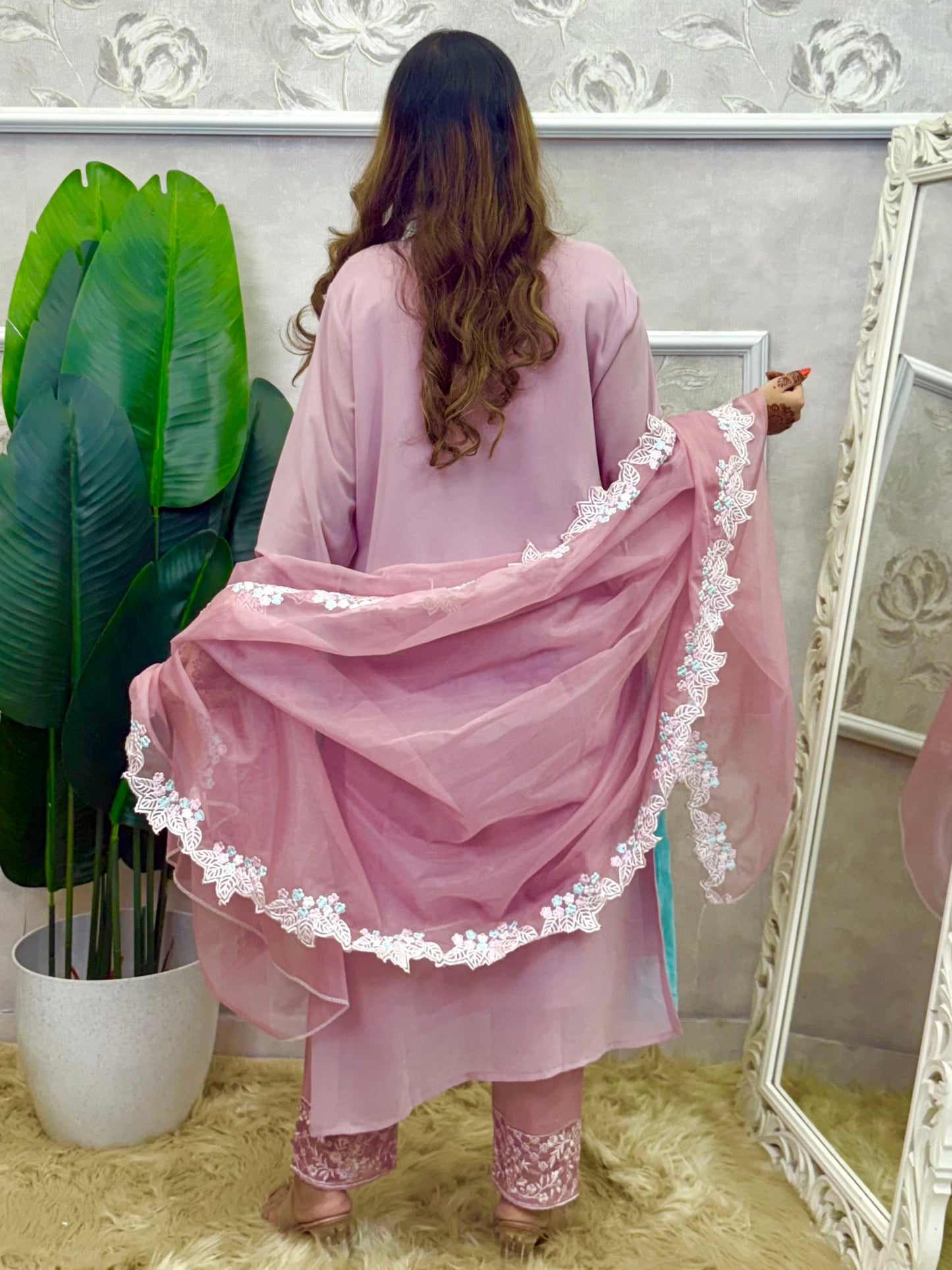 Model wearing a dusty pink georgette kurta with hand embroidery, lycra stretchable pants, and an organza dupatta – Designer Wear Collection.