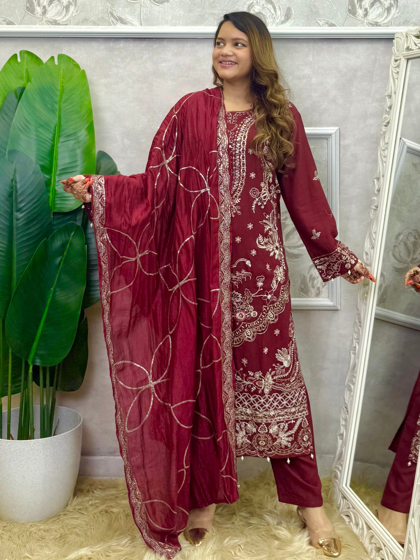 Model wearing a maroon rayon kurta with intricate machine embroidery, paired with rayon pants and a chanderi dupatta – Designer Wear Collection.