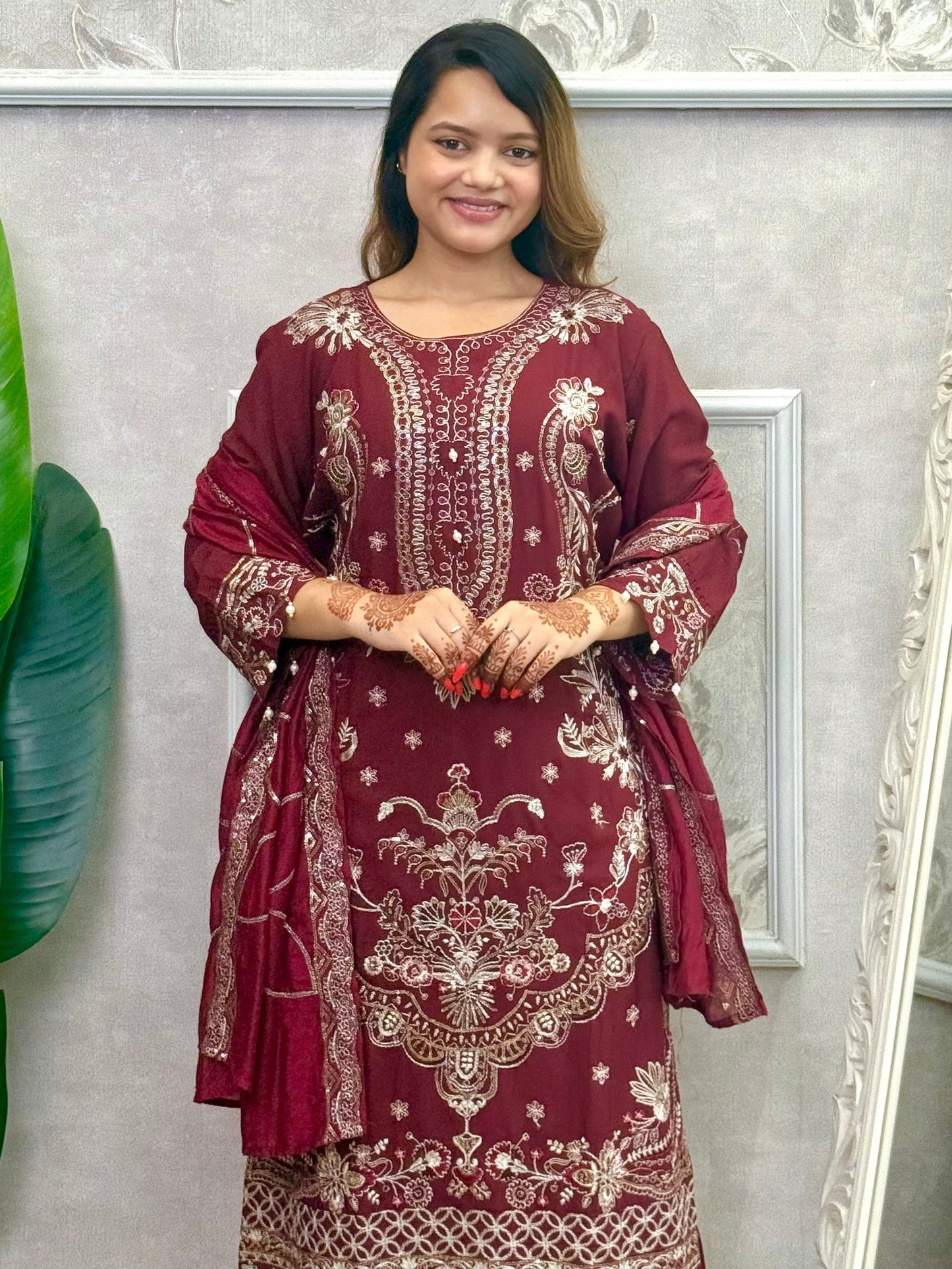 Model wearing a maroon rayon kurta with intricate machine embroidery, paired with rayon pants and a chanderi dupatta – Designer Wear Collection.