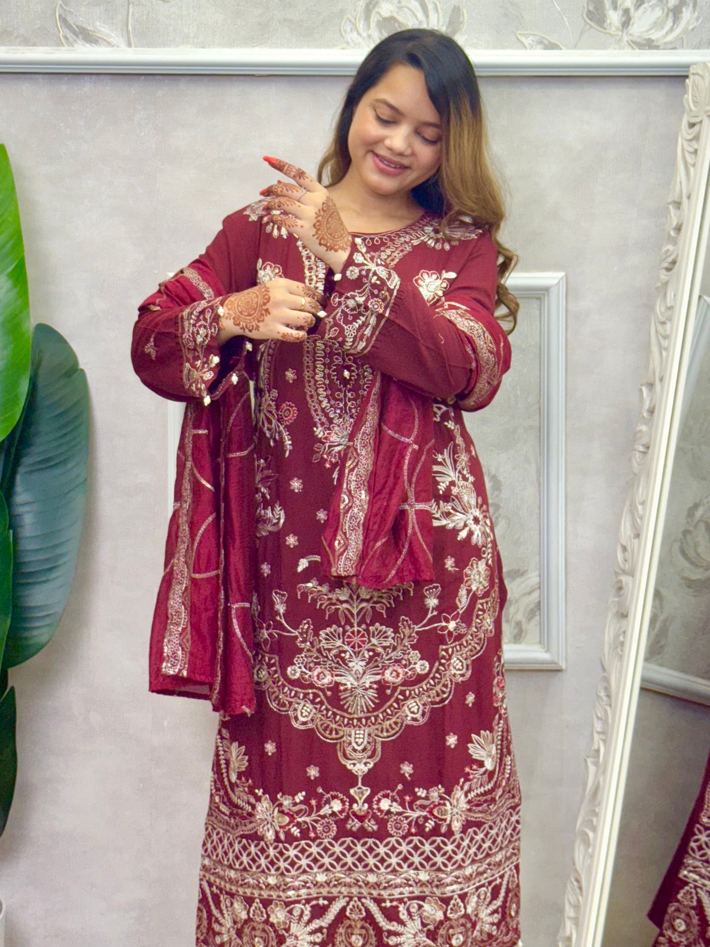 Model wearing a maroon rayon kurta with intricate machine embroidery, paired with rayon pants and a chanderi dupatta – Designer Wear Collection.
