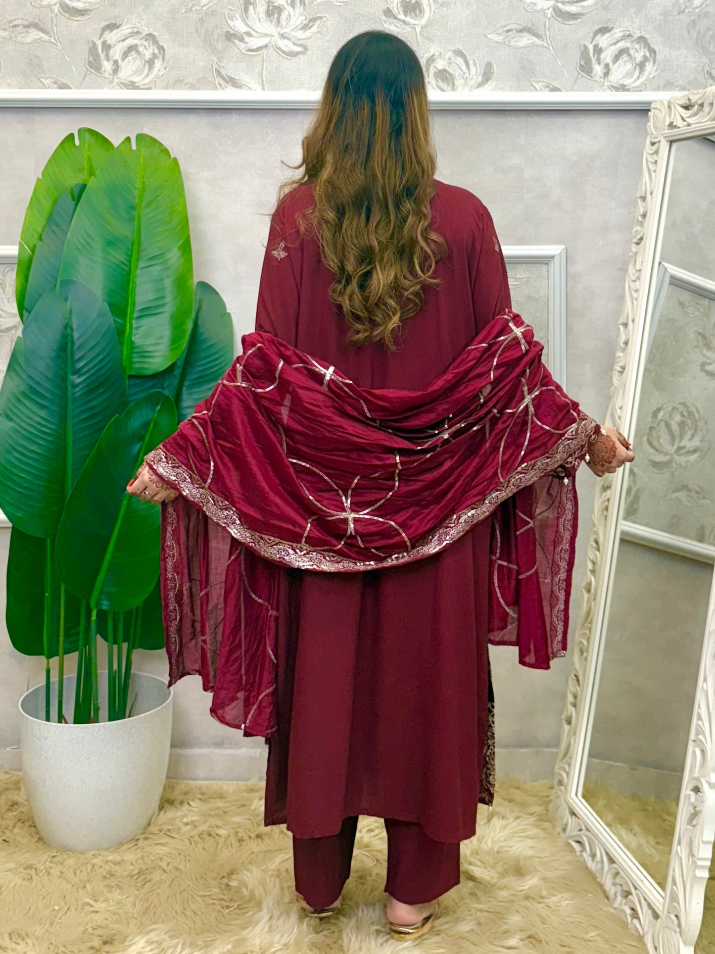 Model wearing a maroon rayon kurta with intricate machine embroidery, paired with rayon pants and a chanderi dupatta – Designer Wear Collection.