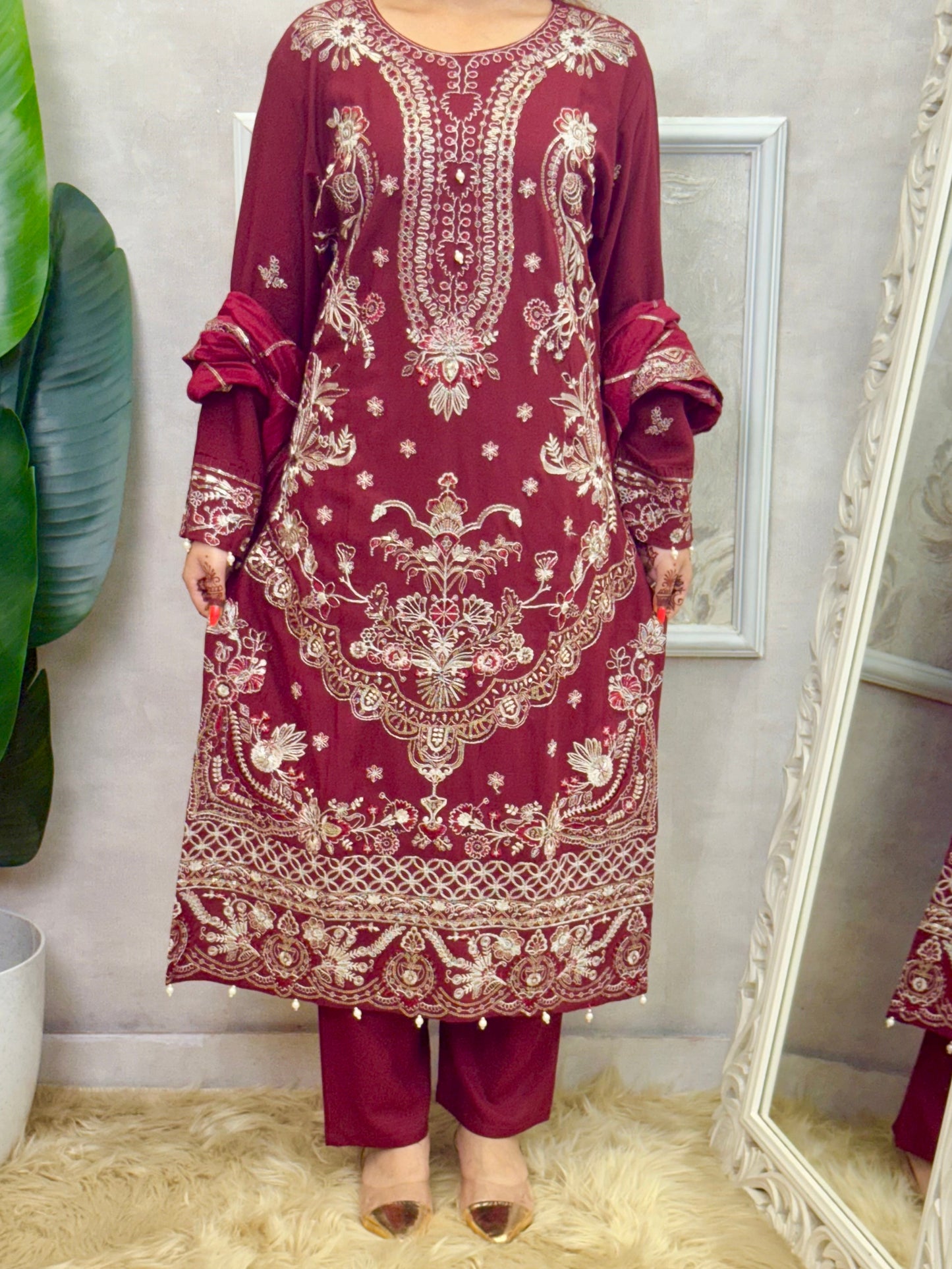 Model wearing a maroon rayon kurta with intricate machine embroidery, paired with rayon pants and a chanderi dupatta – Designer Wear Collection.