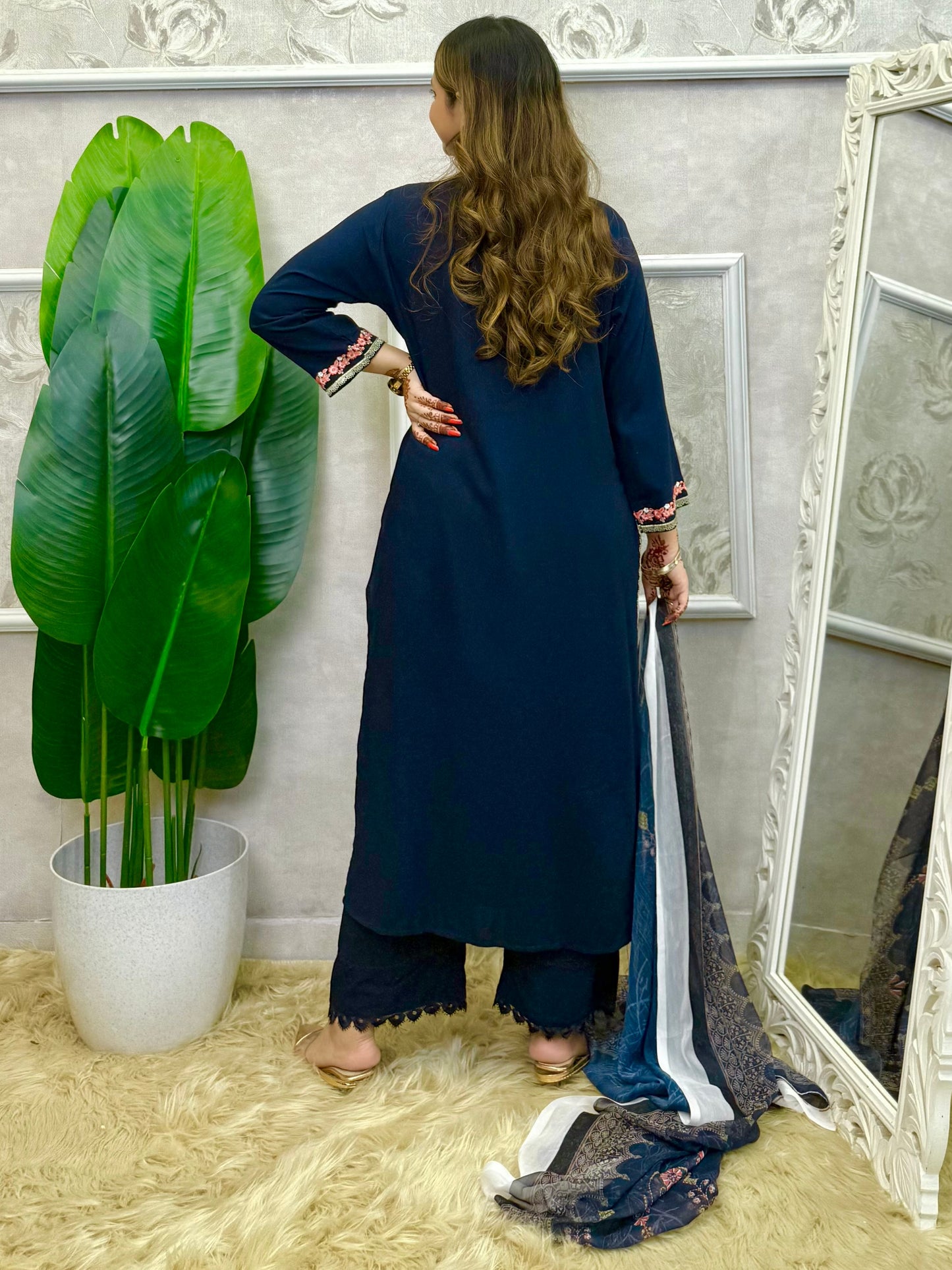 Model wearing a navy blue rayon kurta with intricate machine embroidery, paired with rayon pants and a chiffon dupatta – Designer Wear Collection.
