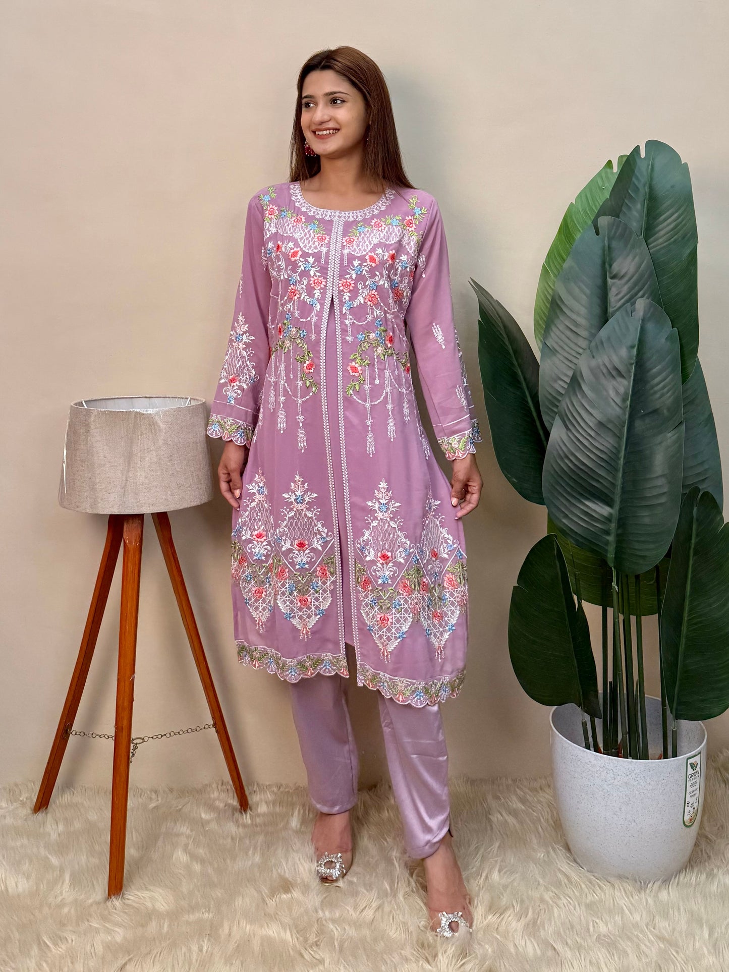 Model wearing a lavender georgette embroidered kurta with multicolor machine embroidery, paired with lycra stretchable pants – Designer Wear Collection.