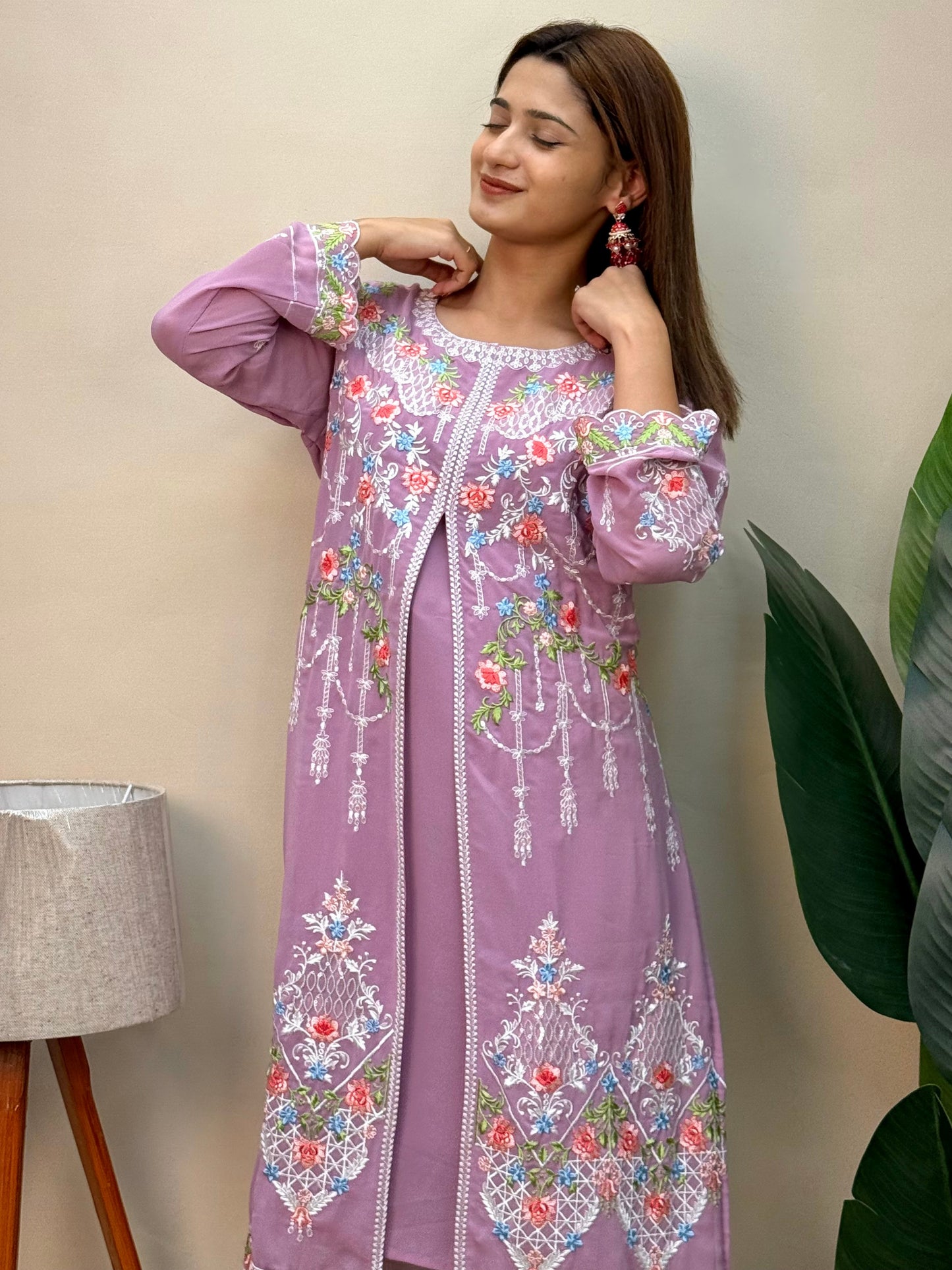 Model wearing a lavender georgette embroidered kurta with multicolor machine embroidery, paired with lycra stretchable pants – Designer Wear Collection.