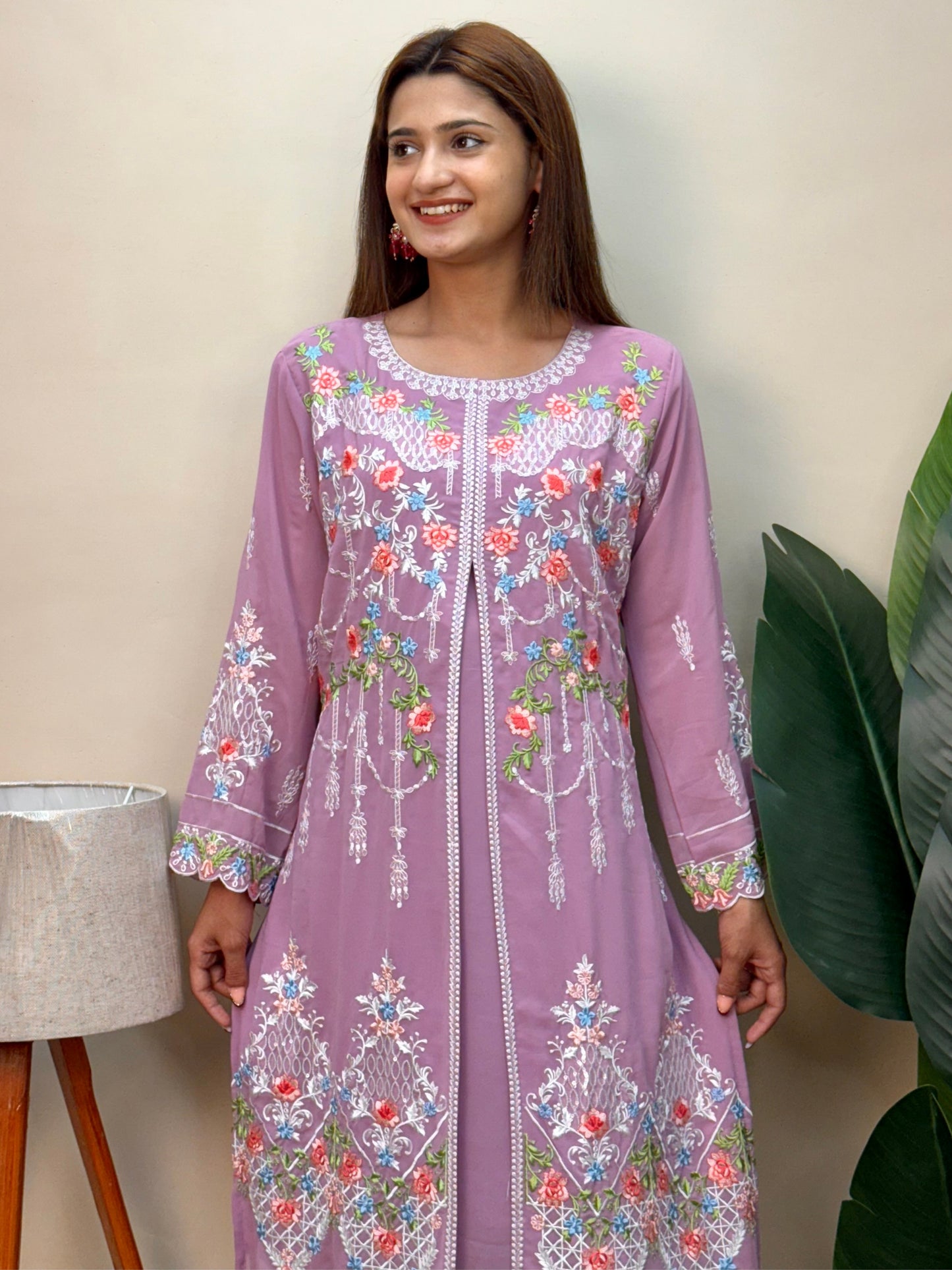 Model wearing a lavender georgette embroidered kurta with multicolor machine embroidery, paired with lycra stretchable pants – Designer Wear Collection.