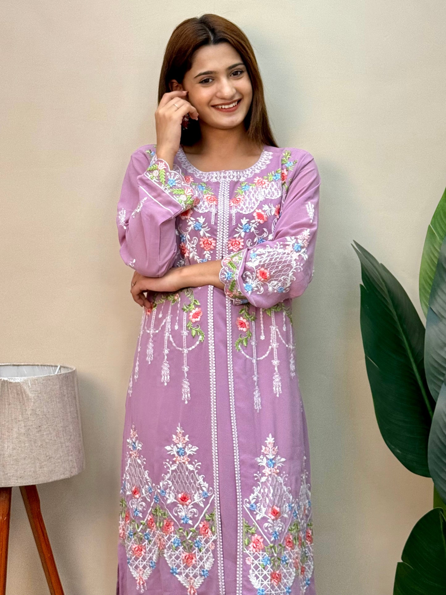 Model wearing a lavender georgette embroidered kurta with multicolor machine embroidery, paired with lycra stretchable pants – Designer Wear Collection.