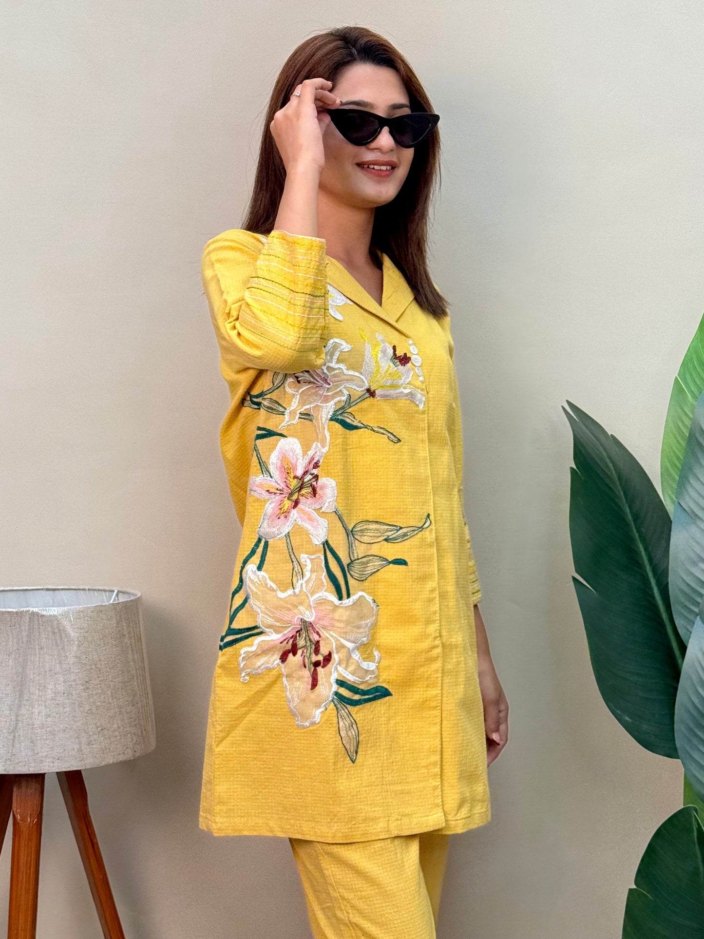 Model wearing a sunflower yellow cotton co-ord set with embroidered kurta and matching cotton pants – Designer Wear Collection.