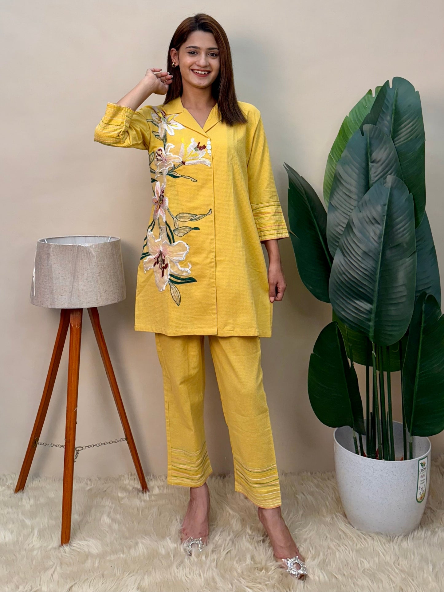 Model wearing a sunflower yellow cotton co-ord set with embroidered kurta and matching cotton pants – Designer Wear Collection.