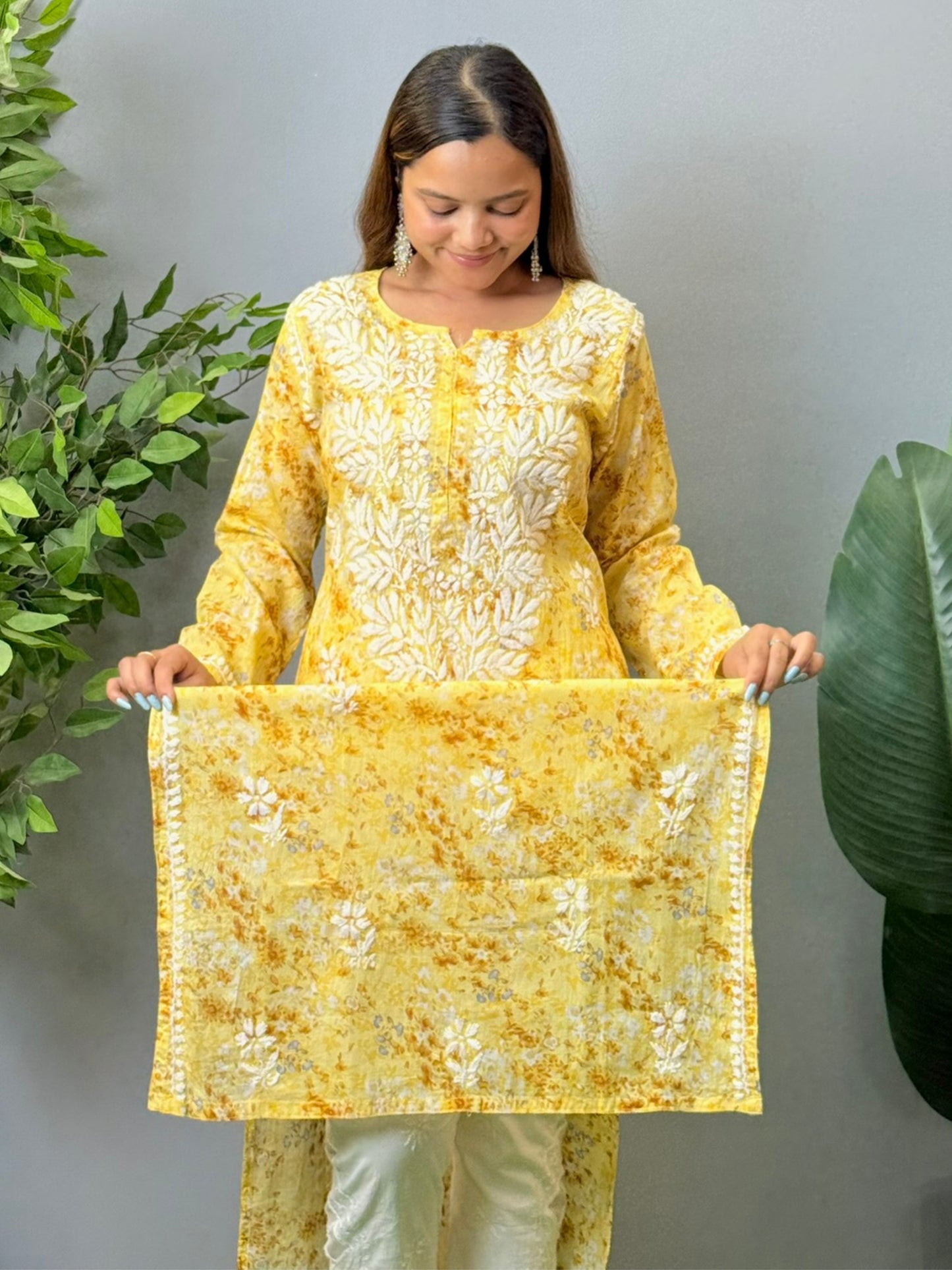Model wearing a yellow printed mulmul chikankari kurta with white embroidery – perfect for summer