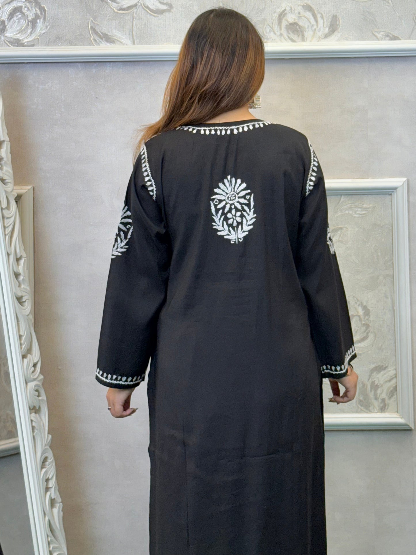 Black Roman silk Lucknow Chikankari kurta and palazzo set with white hand embroidery.