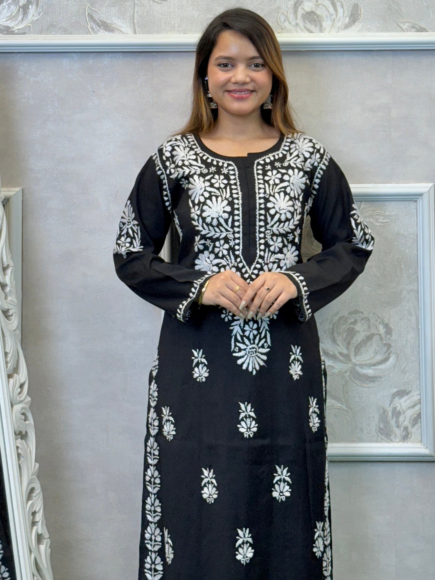 Black Roman silk Lucknow Chikankari kurta and palazzo set with white hand embroidery.