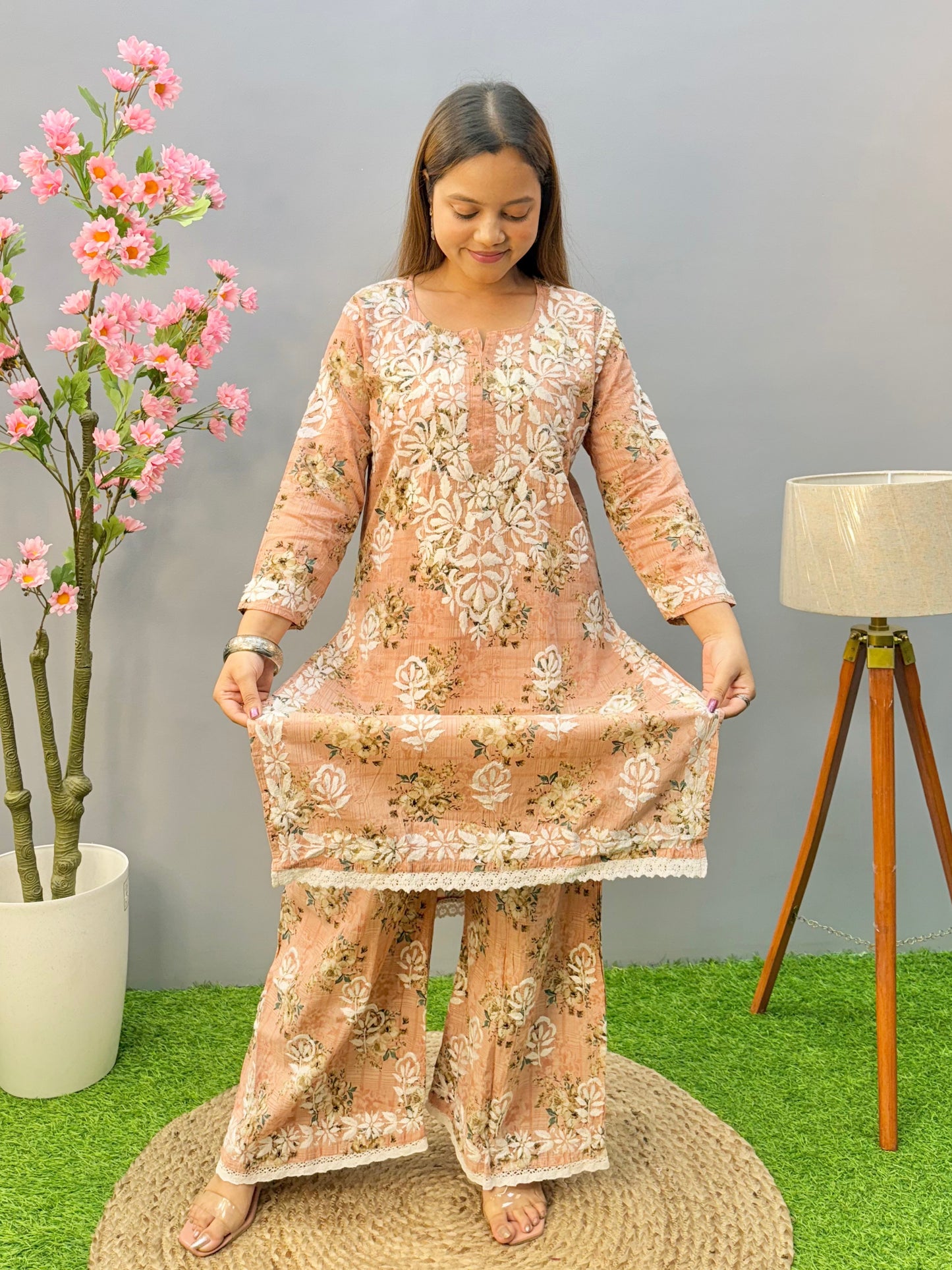 Warm peach printed Lucknow Chikankari mulmul kurta palazzo set with lace detailing