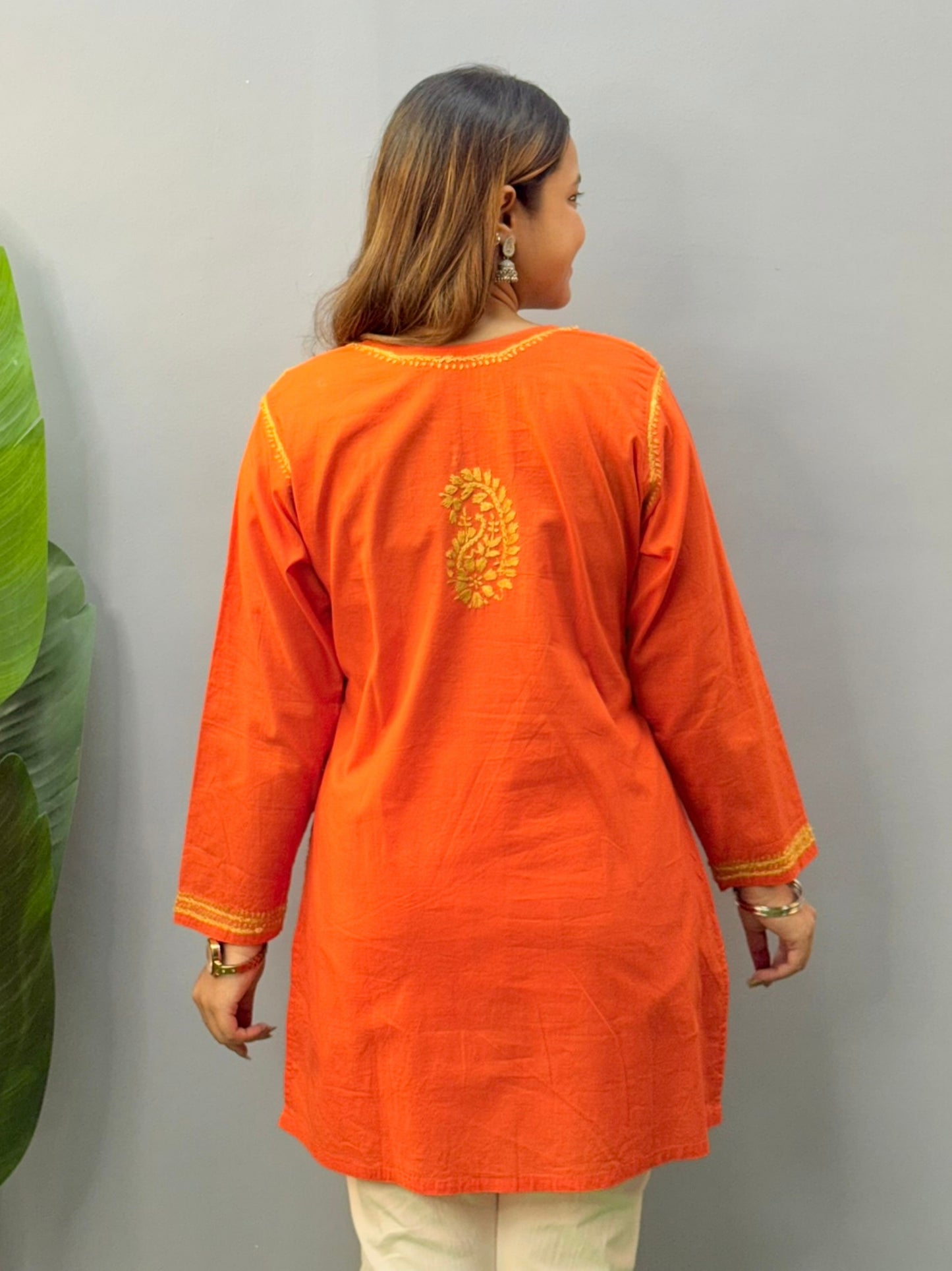 Fiery orange short cotton Chikankari kurta with golden hand embroidery, perfect for casual or everyday wear